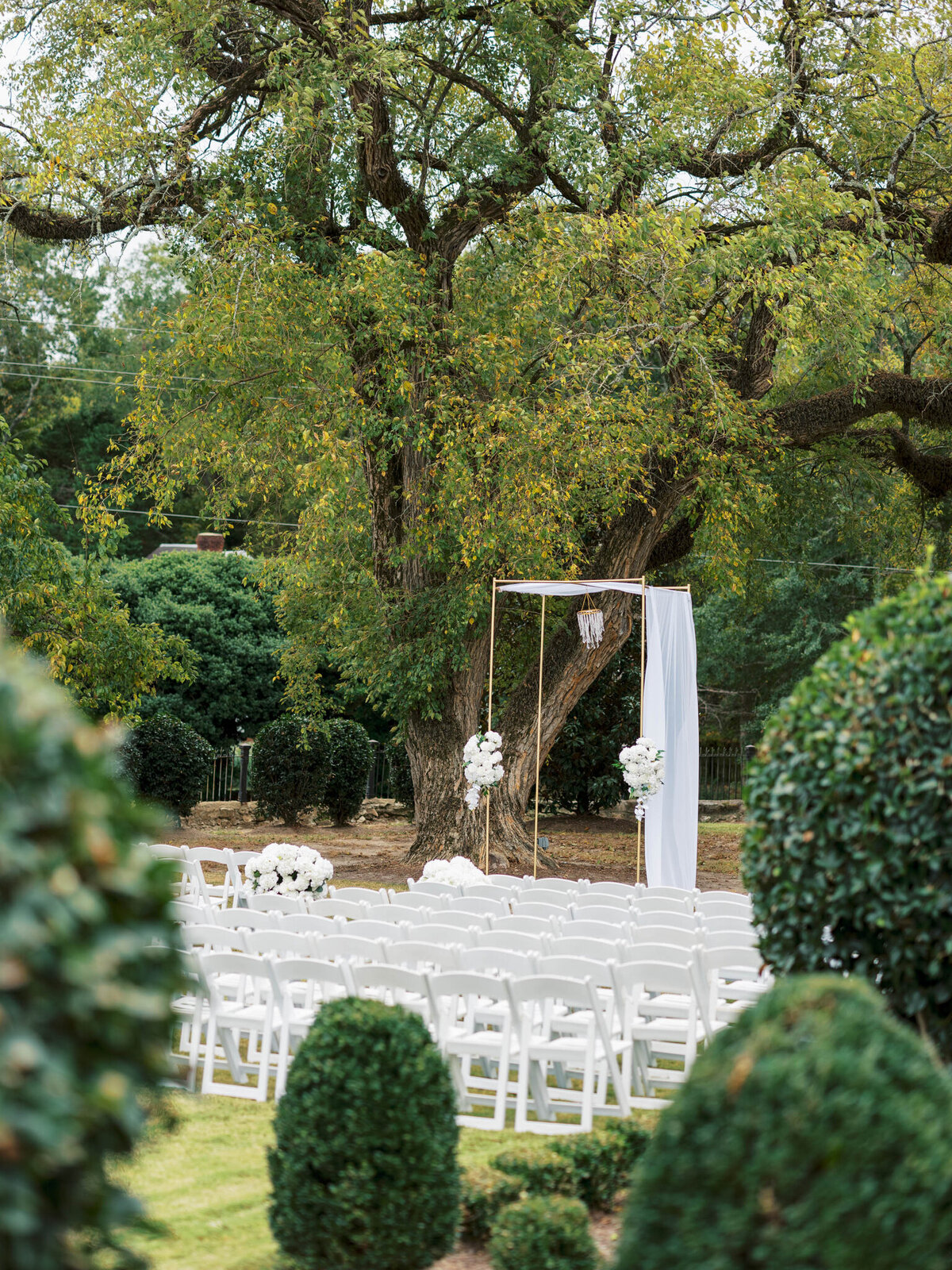 Shaoleen & Colin American Black + White Wedding- Ceremony - Details 2 tall gold arbor with white chiffon