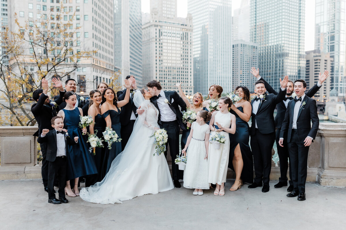 Wedding party celebrating in a modern downtown South Bend venue with the couple.