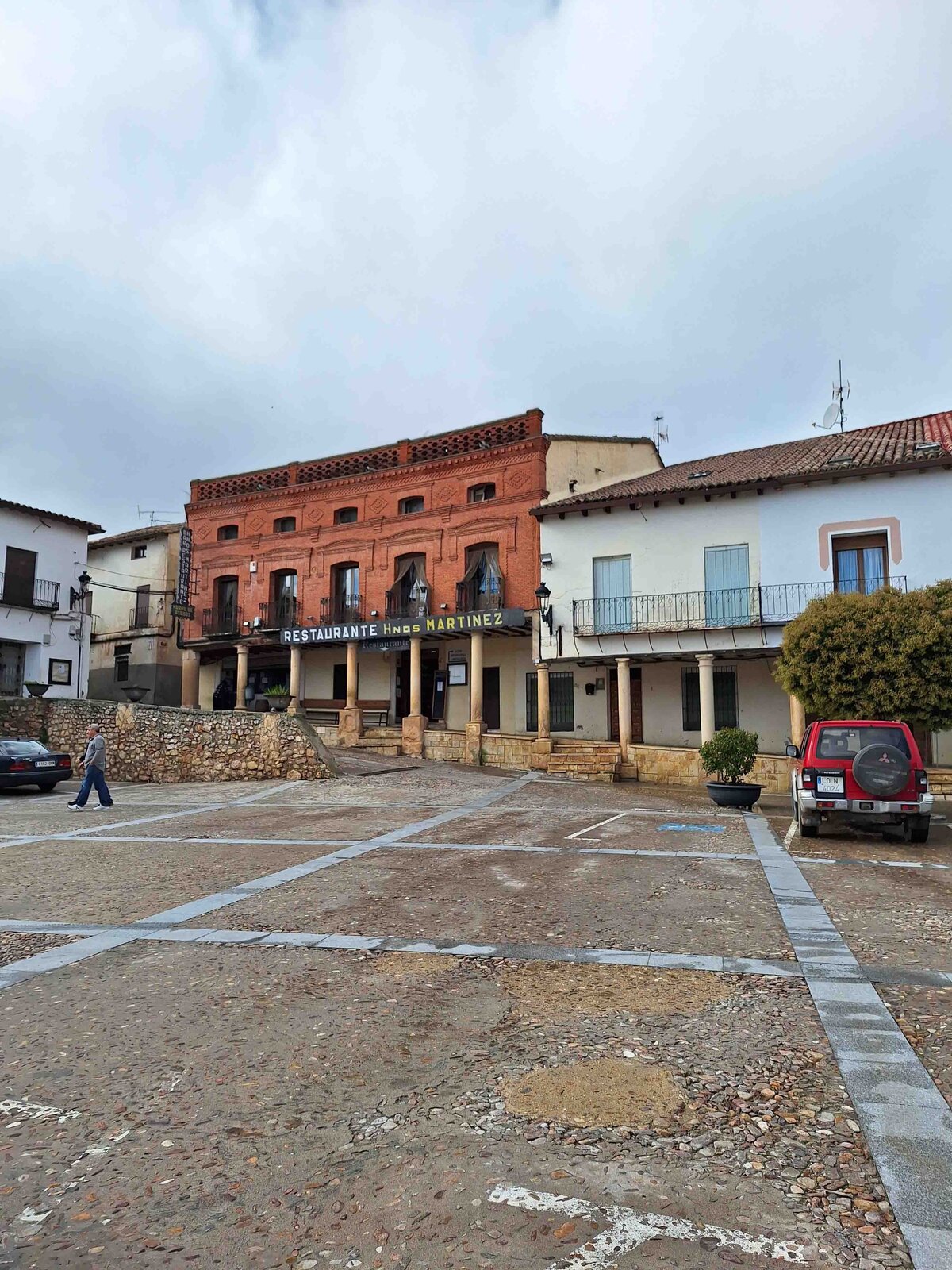 A small plaza with old buildings in the town located near the winery where the Winery Lunch Experience takes place.