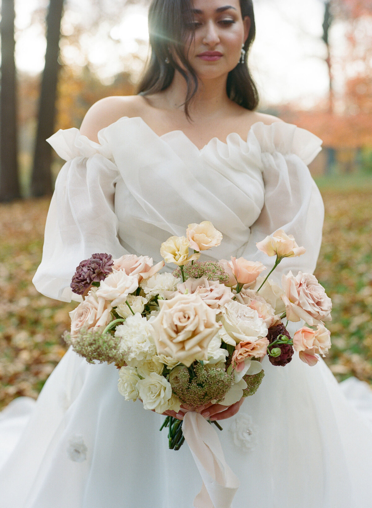 rose bouquet and bride in monique lhuillier ballgown romantic wedding design