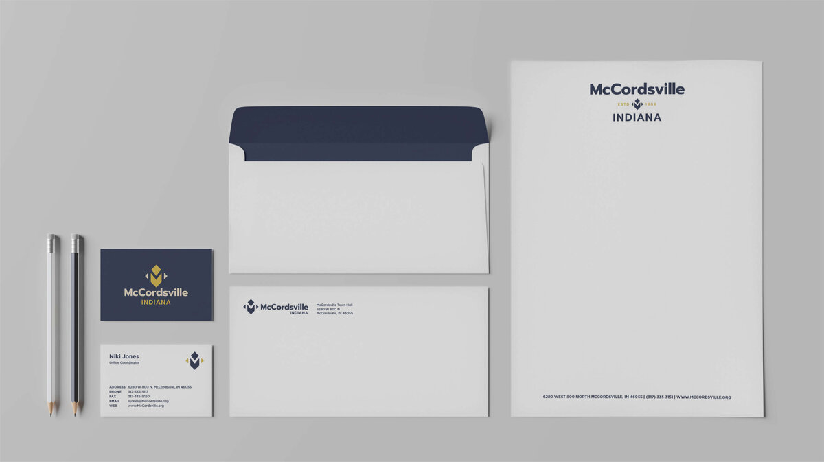 Business cards, envelopes, and letterhead for McCordsville with logo and typography