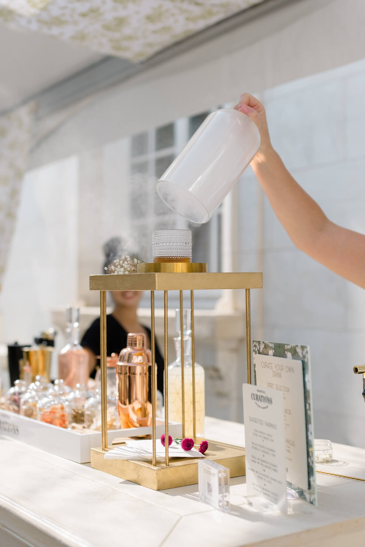 Bartender making a drink at DAR Constitution Hall. Captured by Washington DC Wedding Photographer Bethany Aubre Photography.