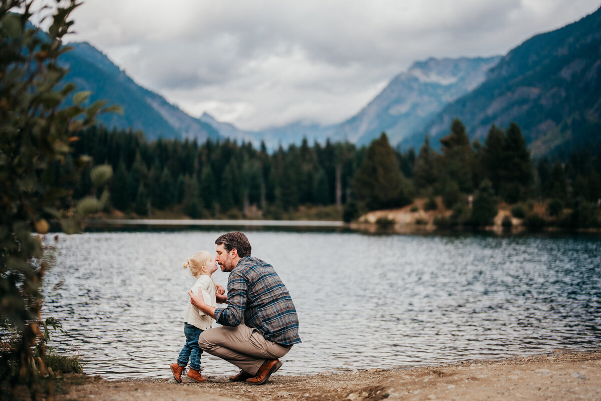 dad-and-his-daughter-having-sweet-moment-near-lake