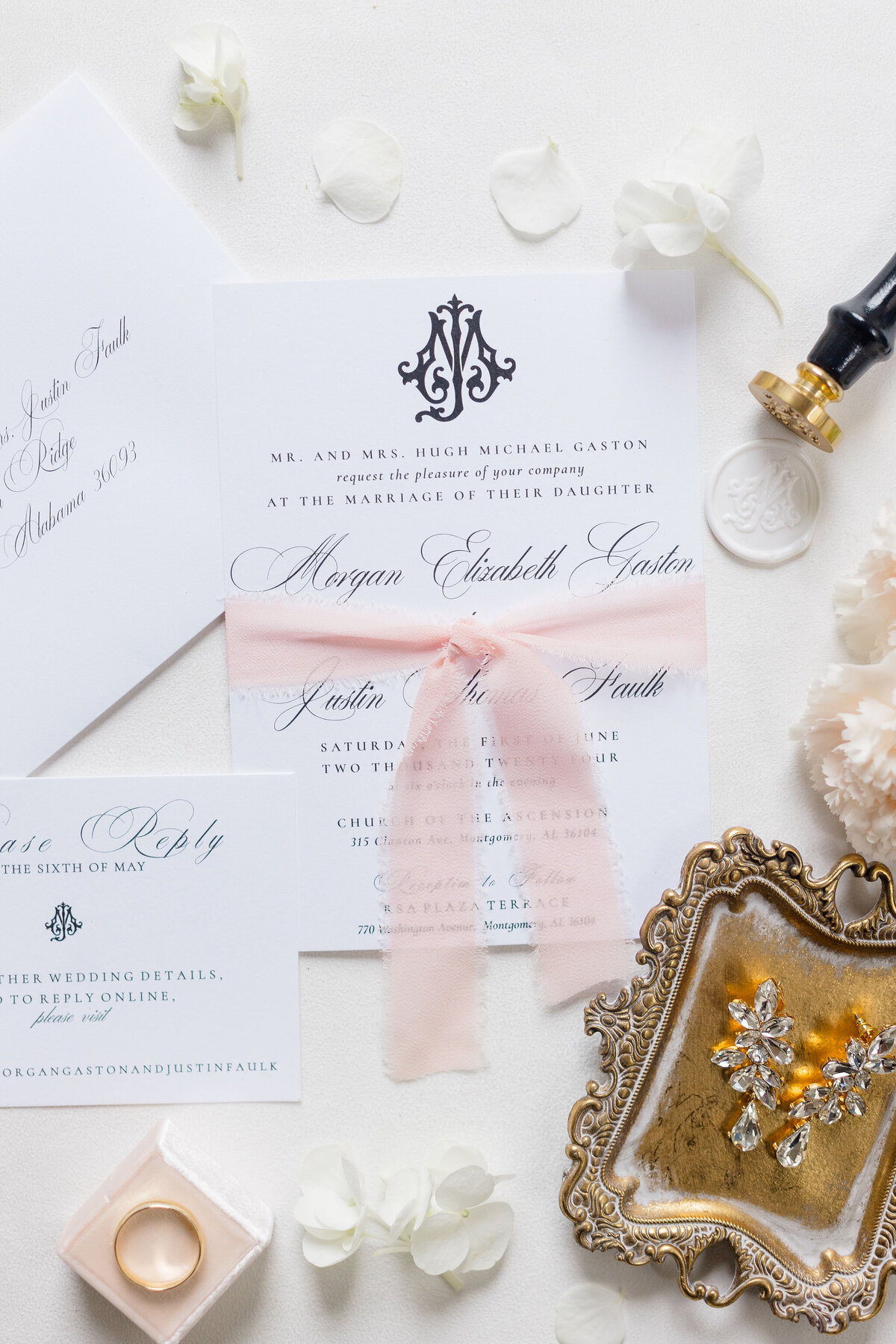 Wedding flatlay with jewelry and invitations