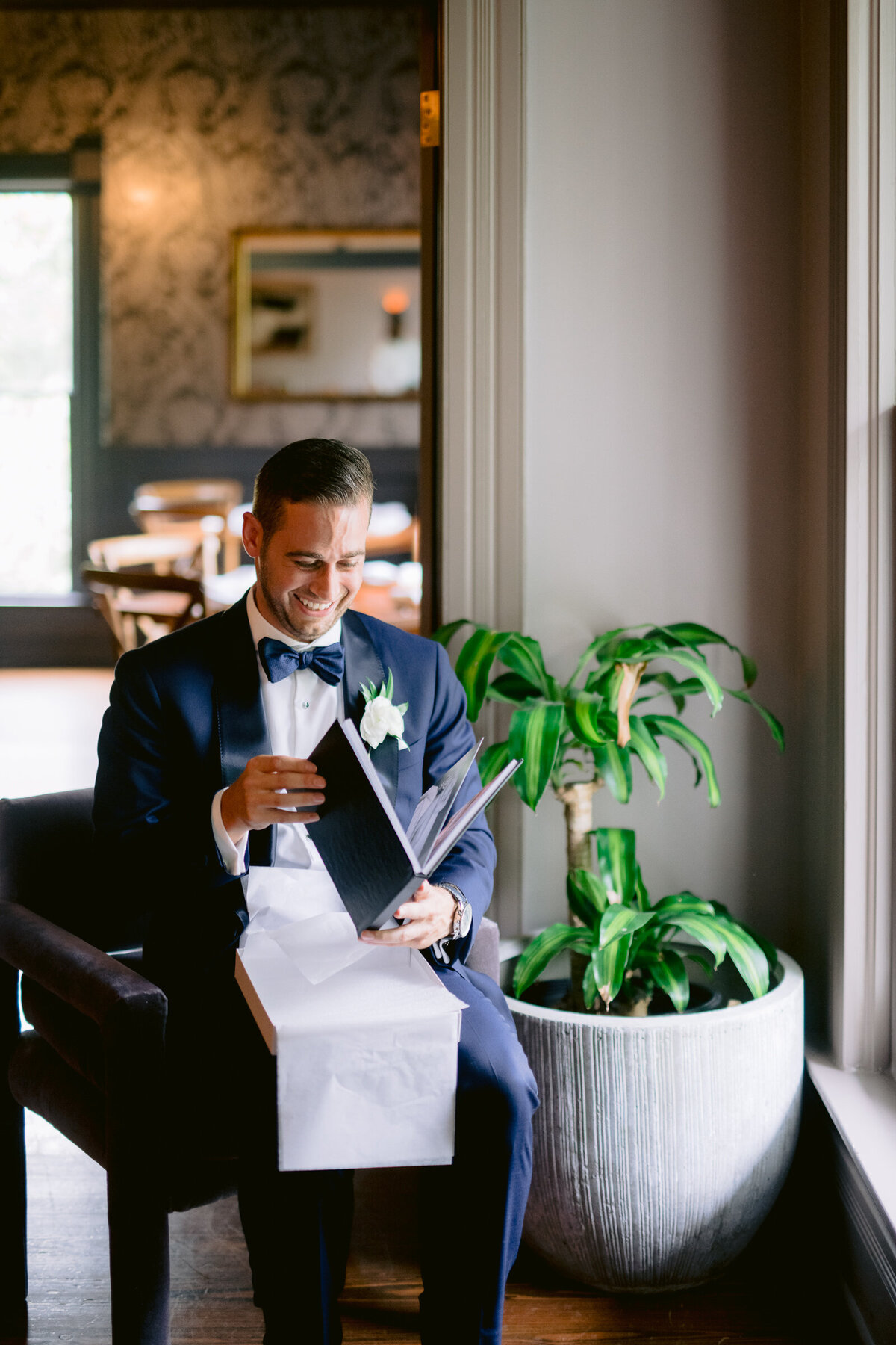 Groom looks through book