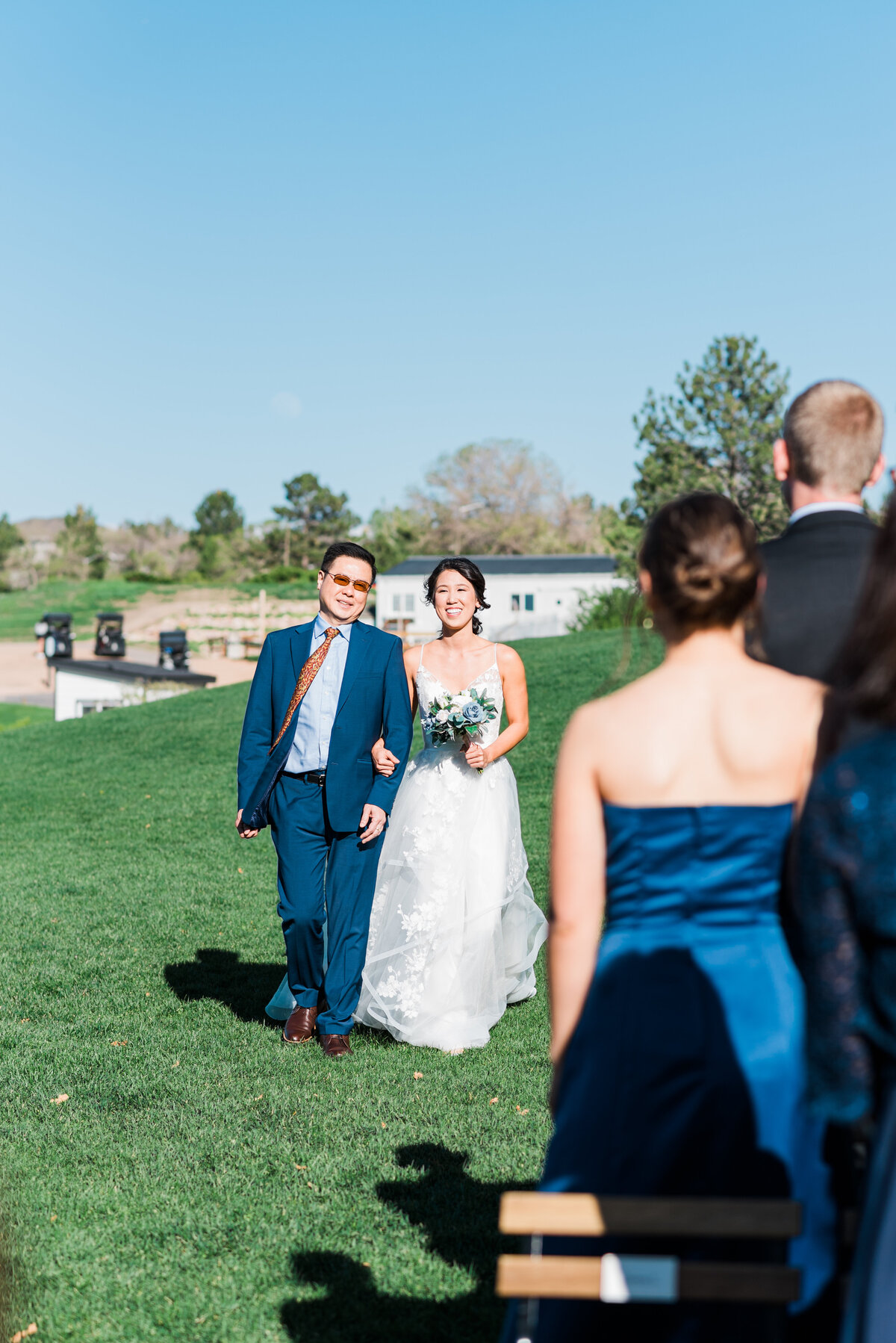 Bride and her father walk down the isle together for her to get married