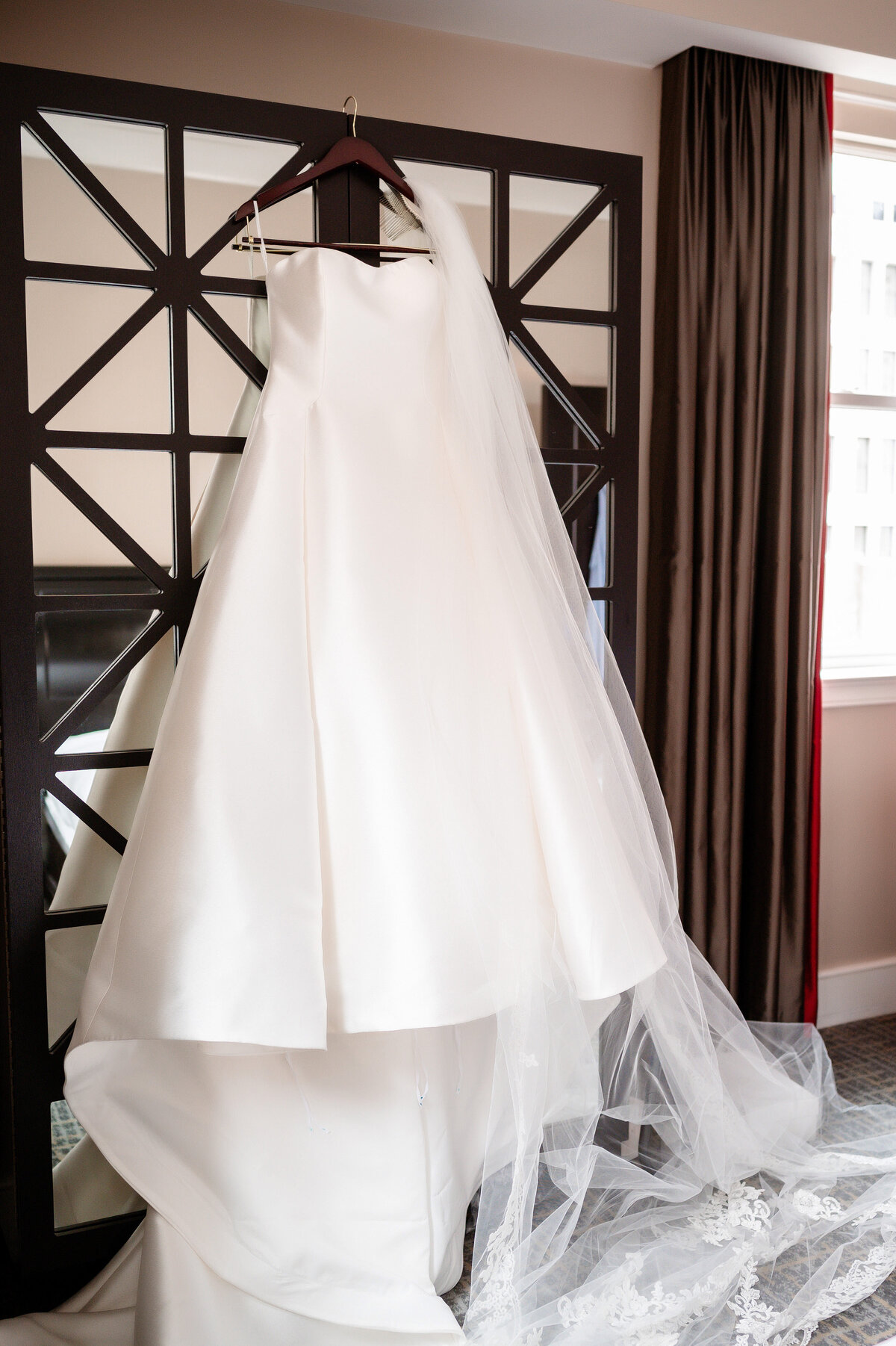 wedding dress hanging in the bridal suite on the twelfth floor of the duquesne club