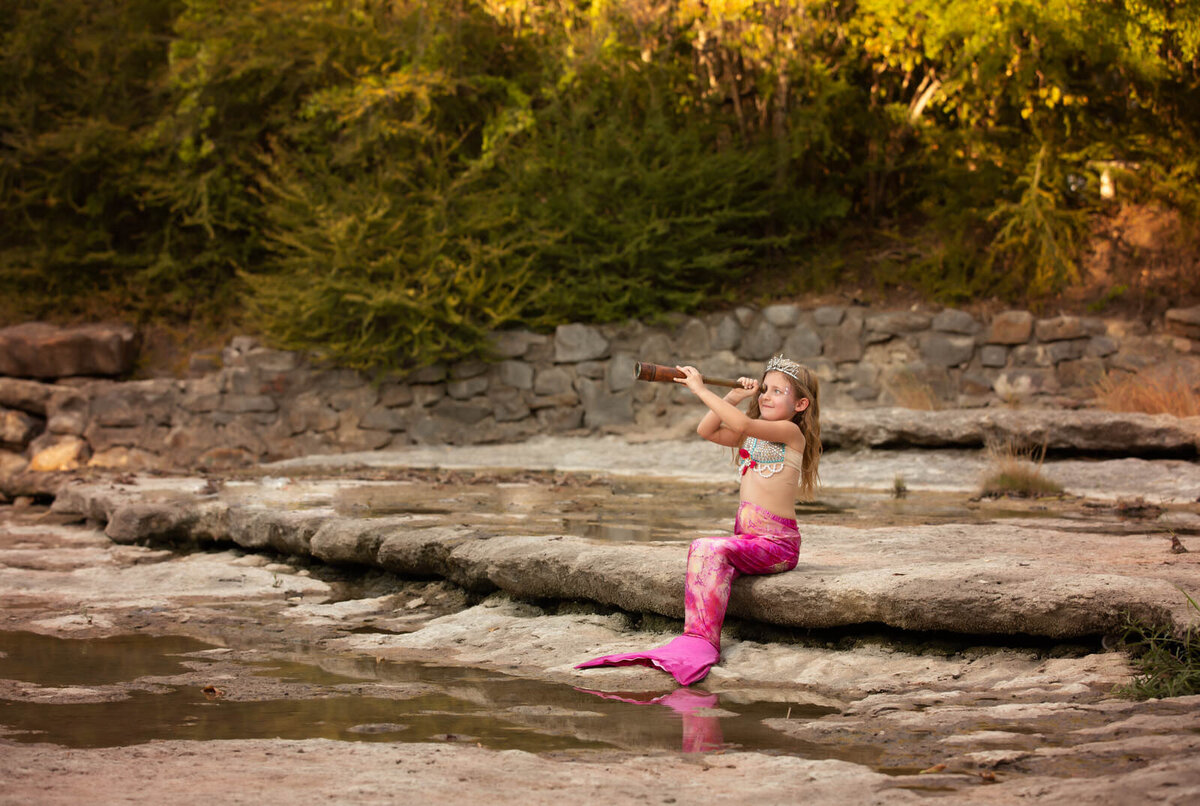 mermaid-sitting-on-rocks-airfield-falls