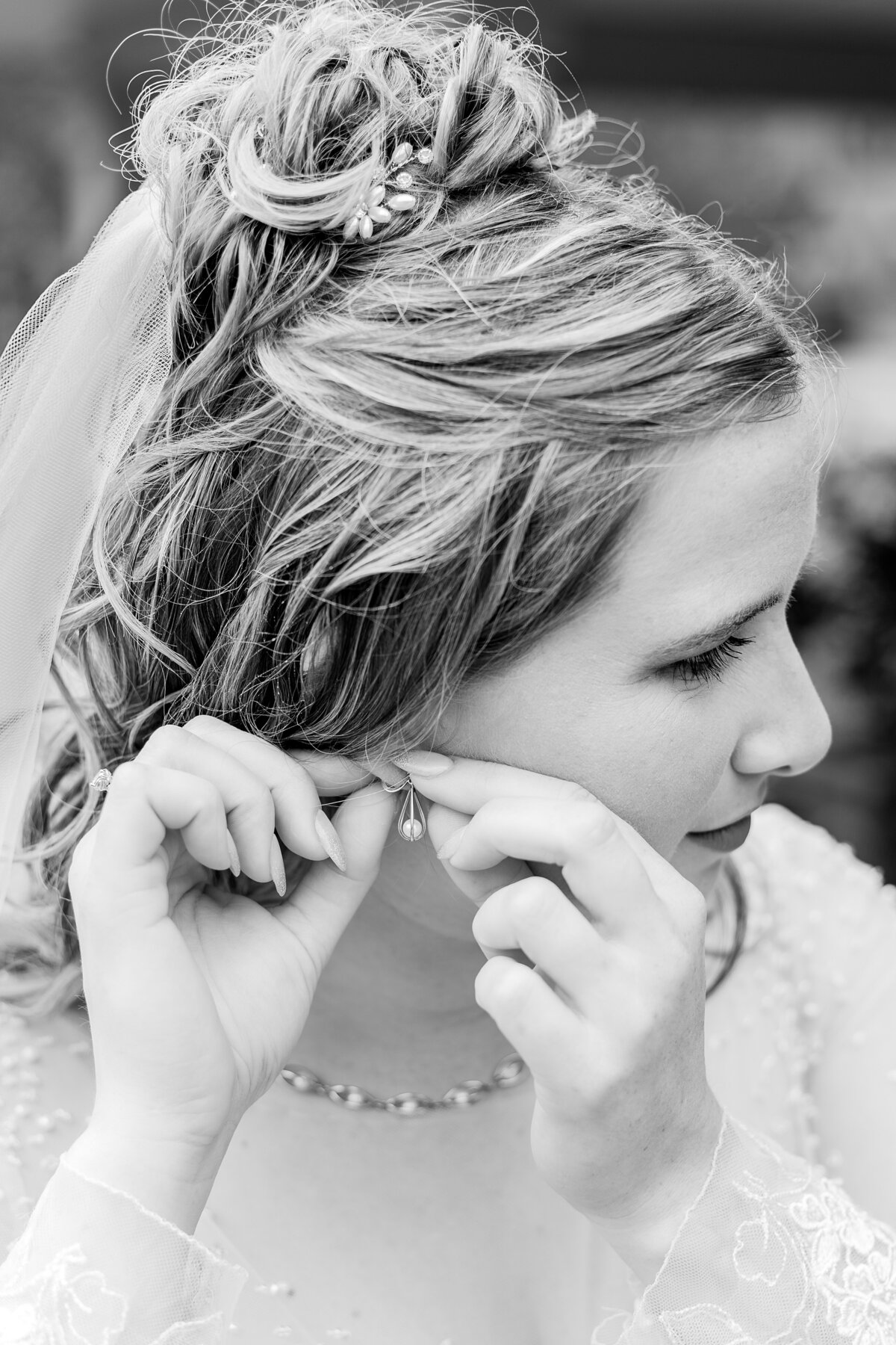 bride-putting-in-earrings