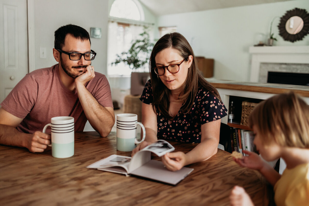 mom and dad drink coffee at kitchen table