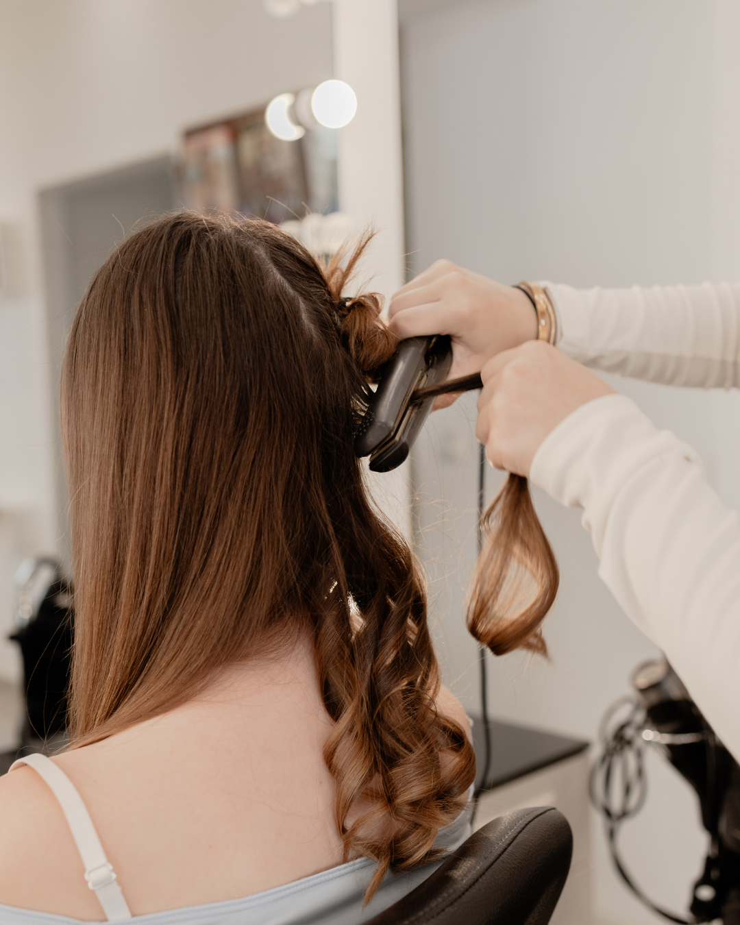 Girl's hair being curled