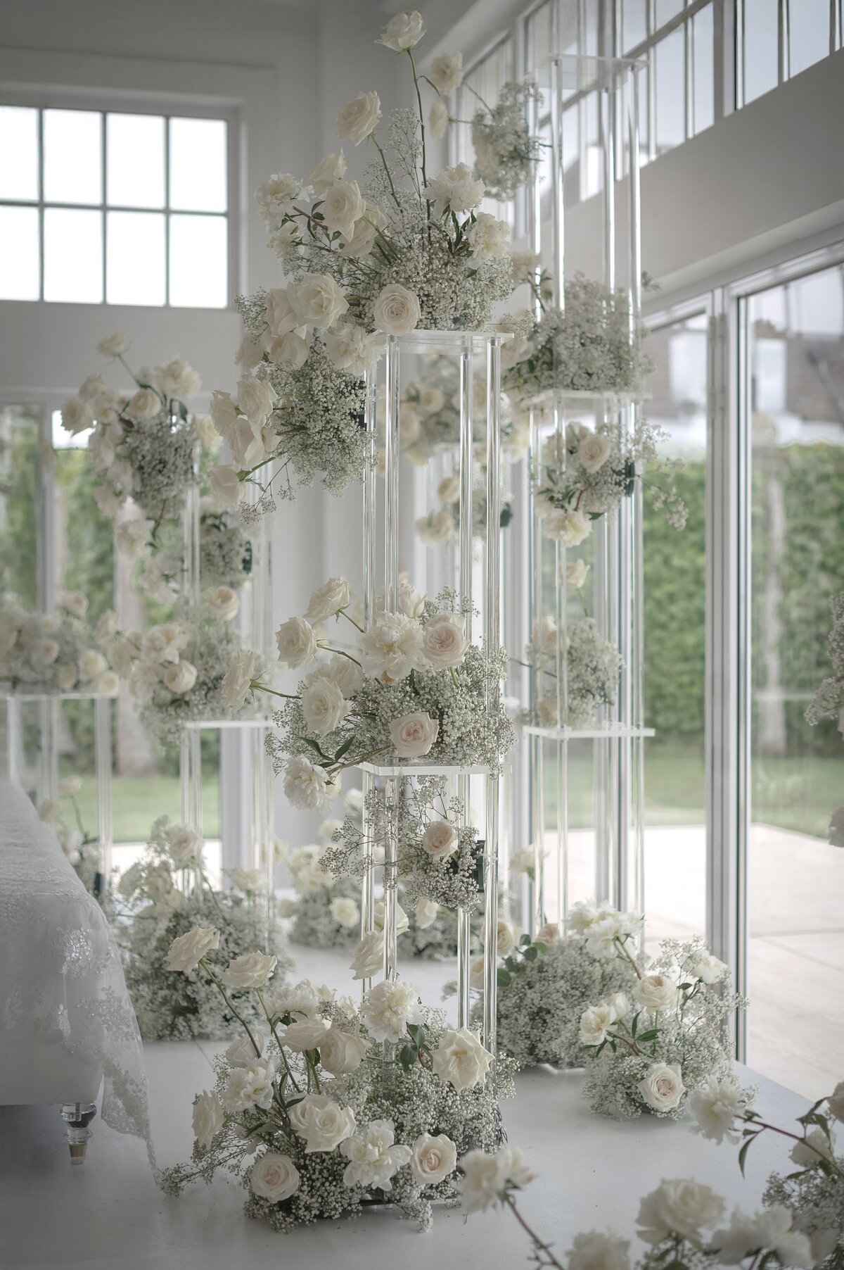 Tier floral decor of cream roses at Belle Mer.