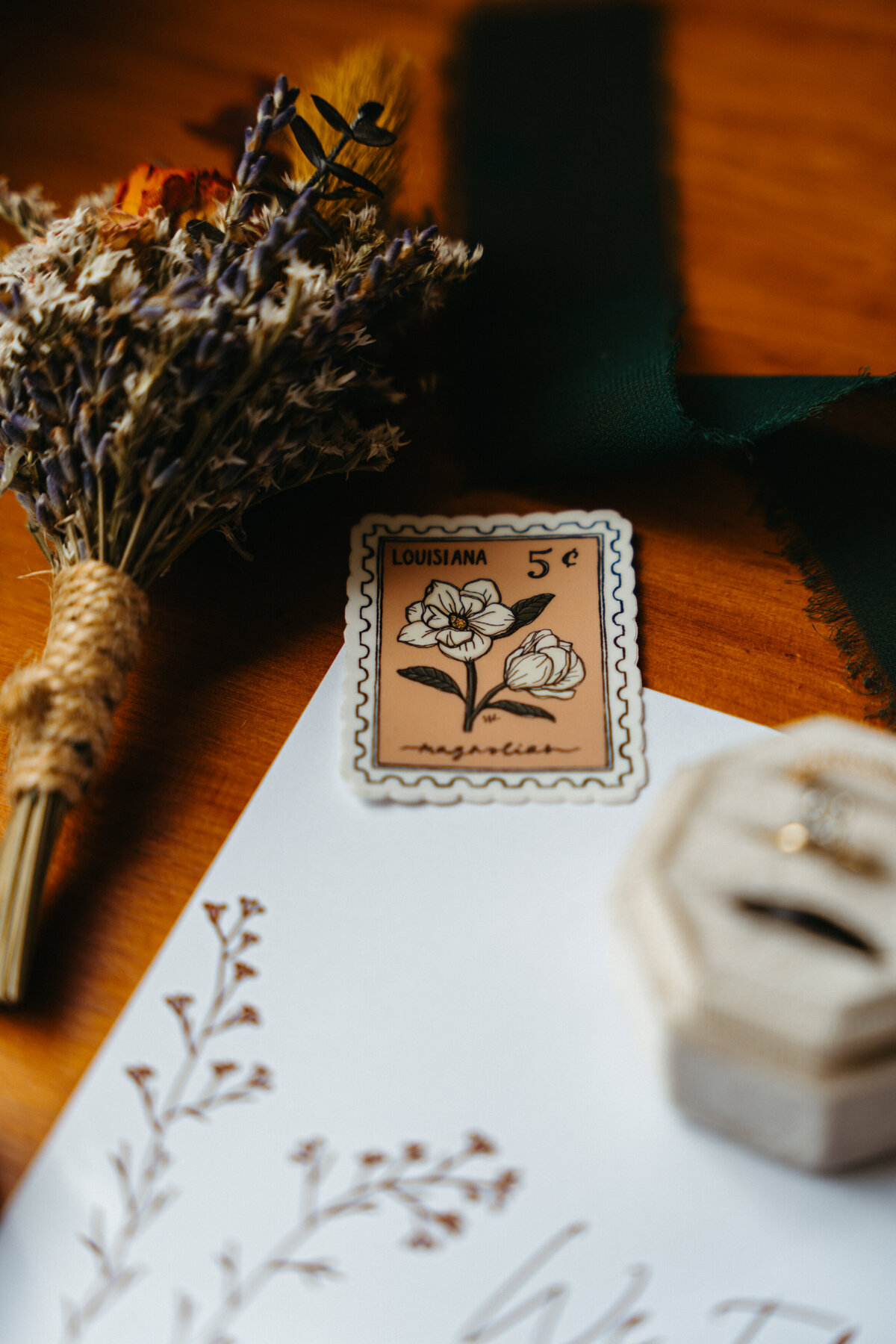 Flatlay with stationery, ribbons, and sentimental Dolomites elopement details