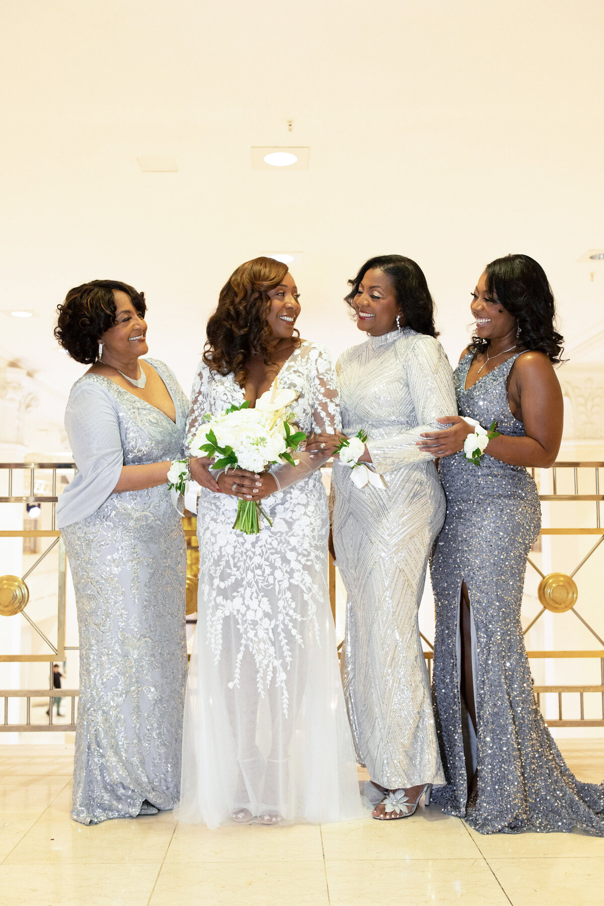 bride-with-family-silver-dresses-elegant-black-wedding-moment