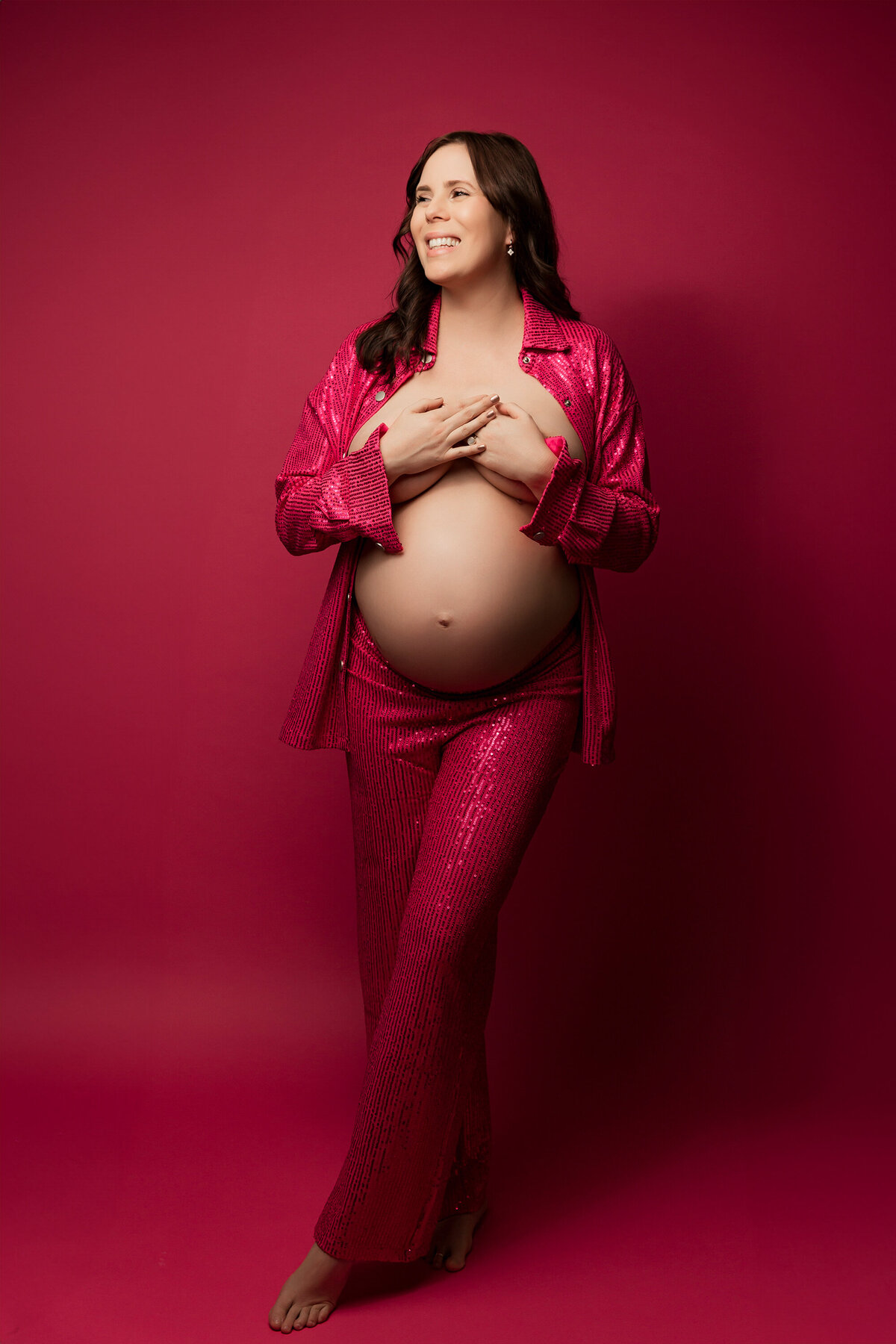 mom in pink sequin outfit for phoenix maternity session