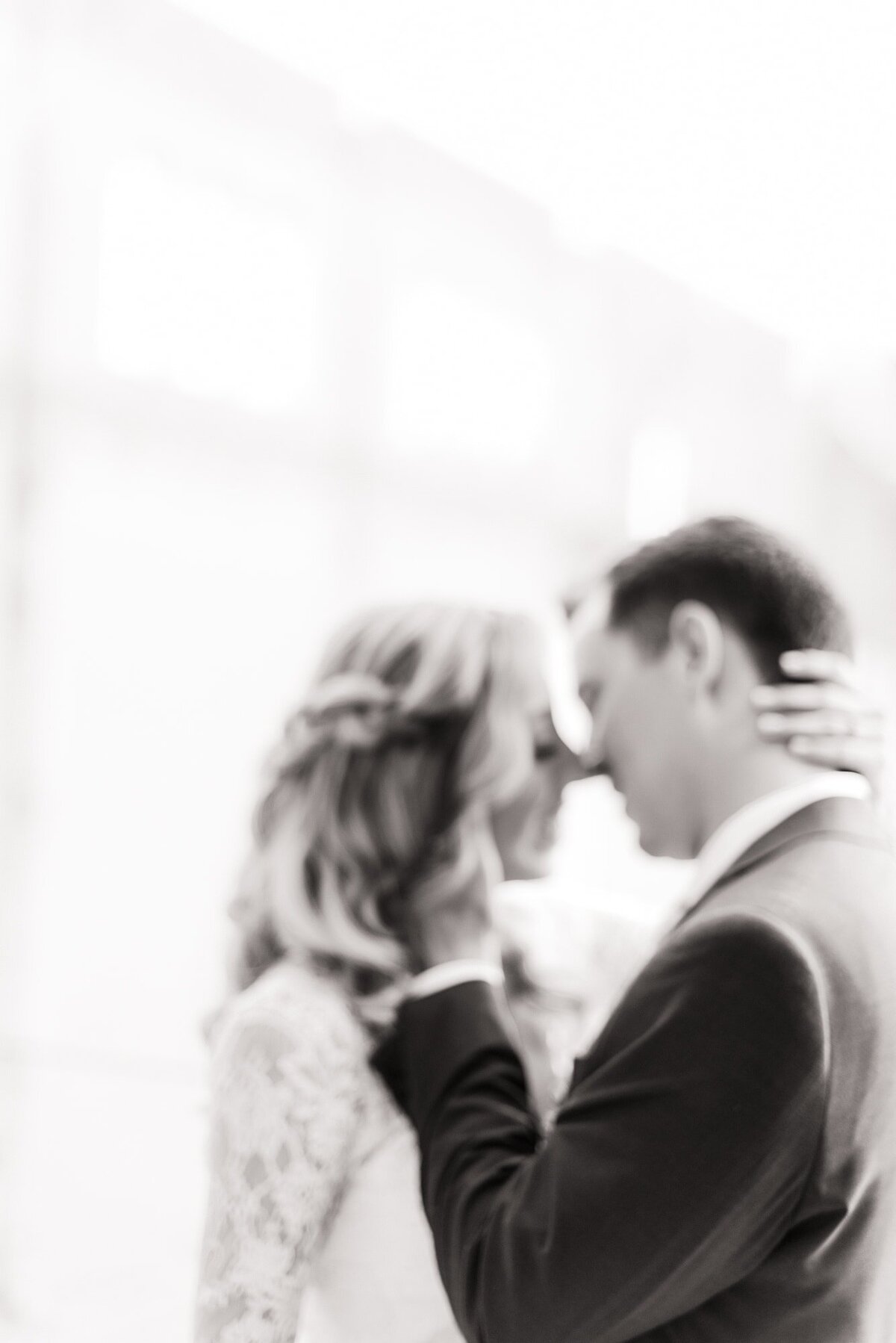 Bride and groom about to kiss and out of focus