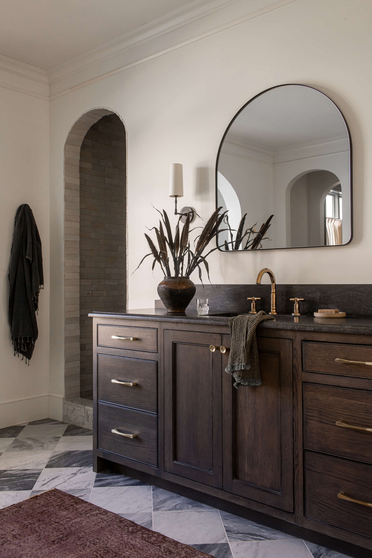 english-tudor-primary-bathroom-dark-wood-vanity-arched-shower