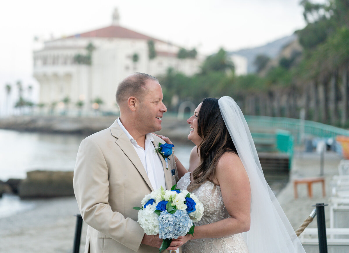 Bride and Groom eloping at Catalina Island venue Descanso Beach with casino.