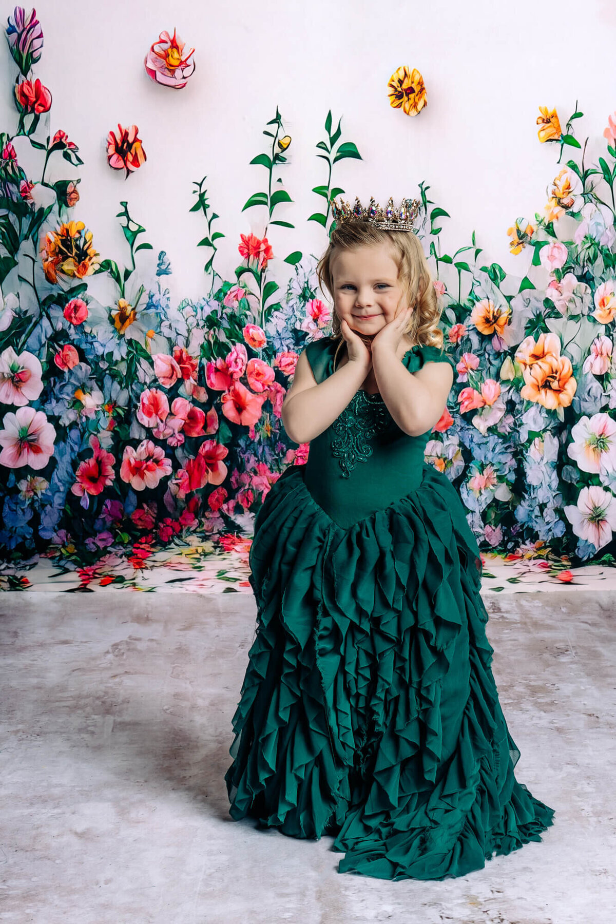 Prescott princess kids photo session with green layered dress against floral wall
