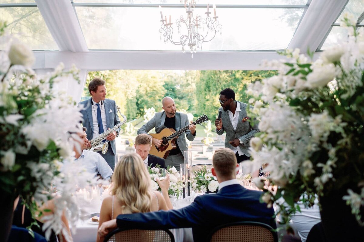 Bride and Groom Getting Serenaded at Reception at Graydon Hall Manor Toronto Jacqueline James Photography