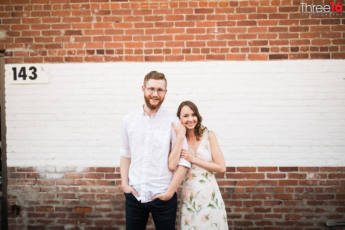 Engaged couple pose for photo session in Old Towne Orange