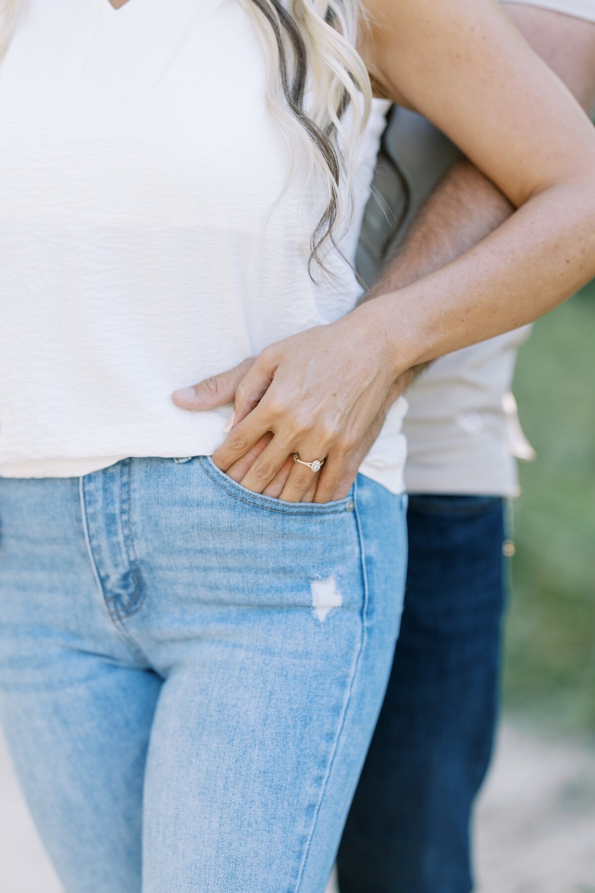 close up of an engaged couple wearing t-shirts and jeans