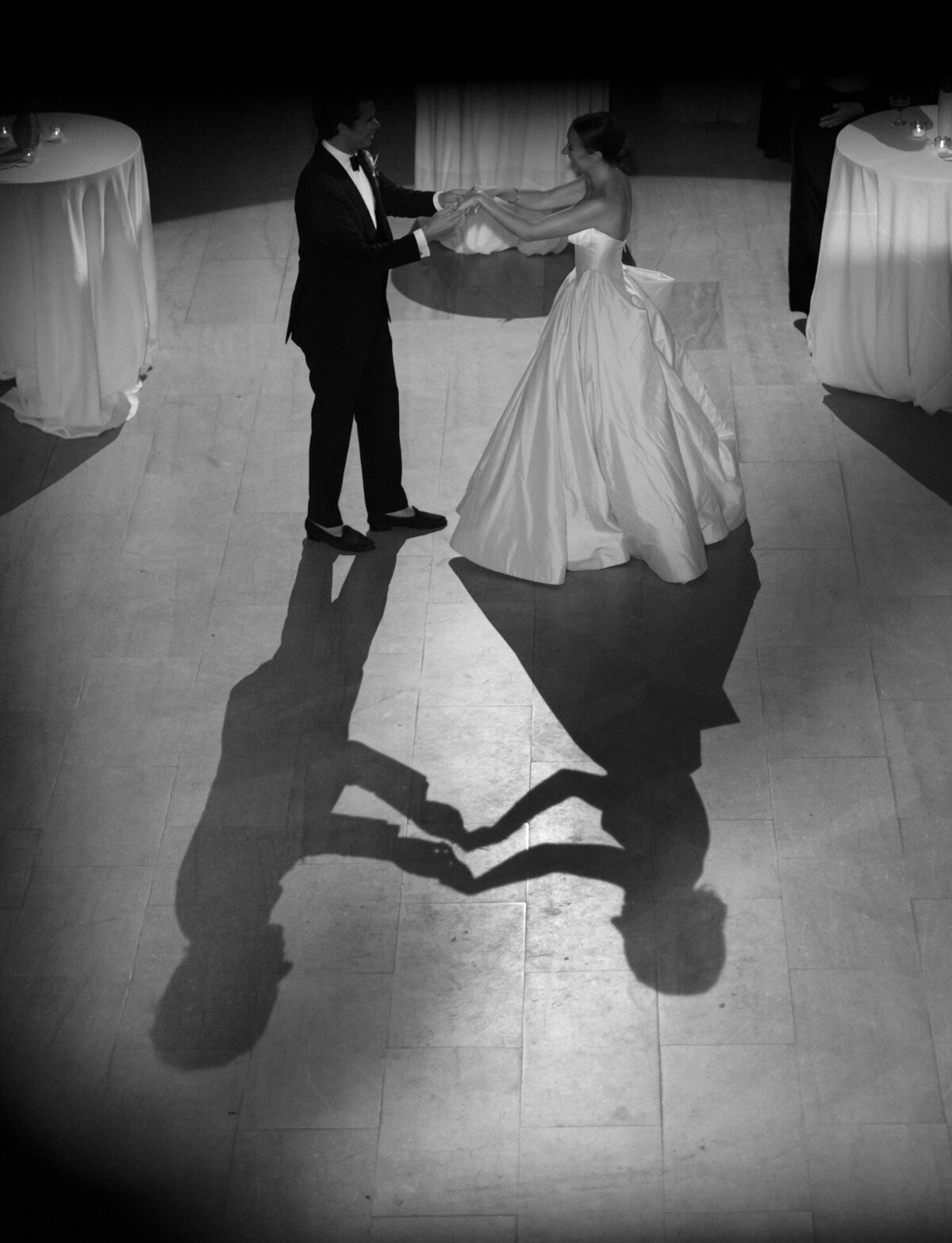 unique angle of a couple & their shadows during their first dance at their Detroit wedding