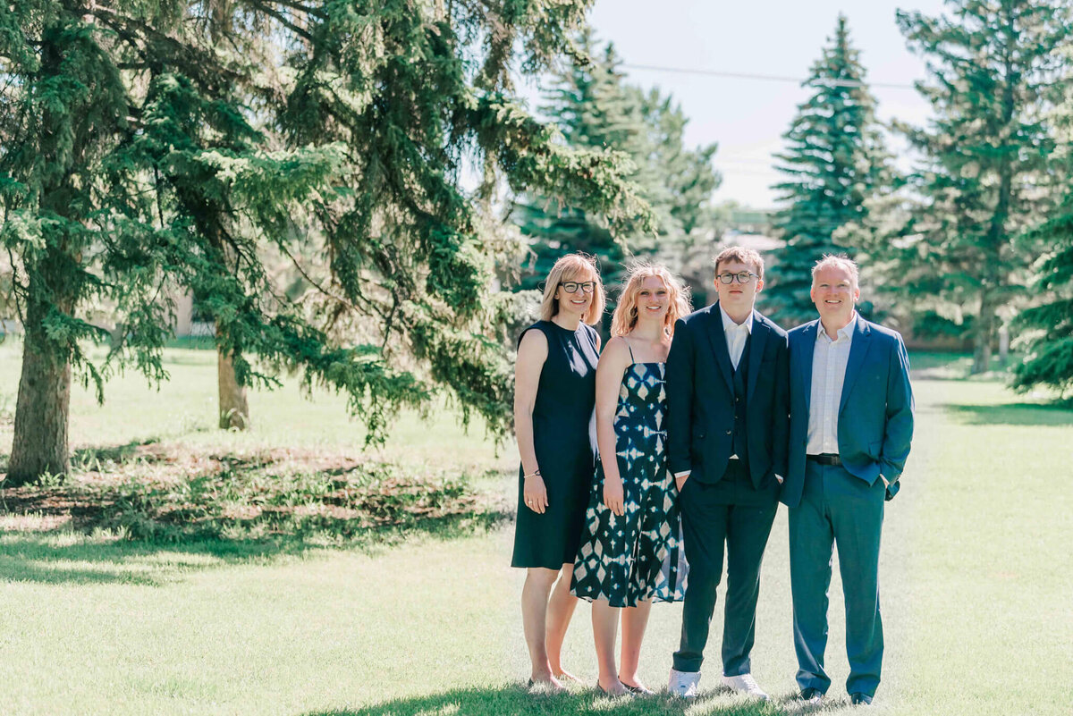 A full length portrait of the whole family. 