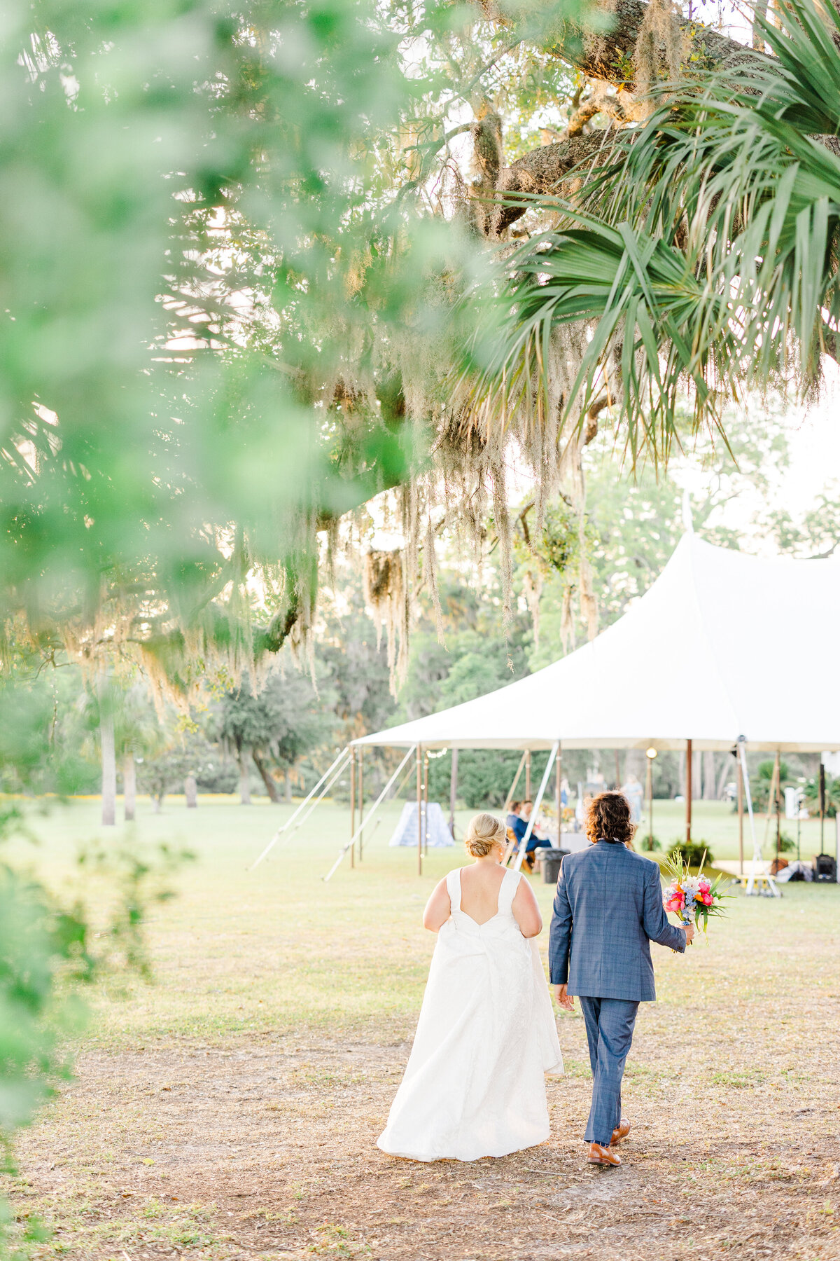 bride and groom walking to their reception