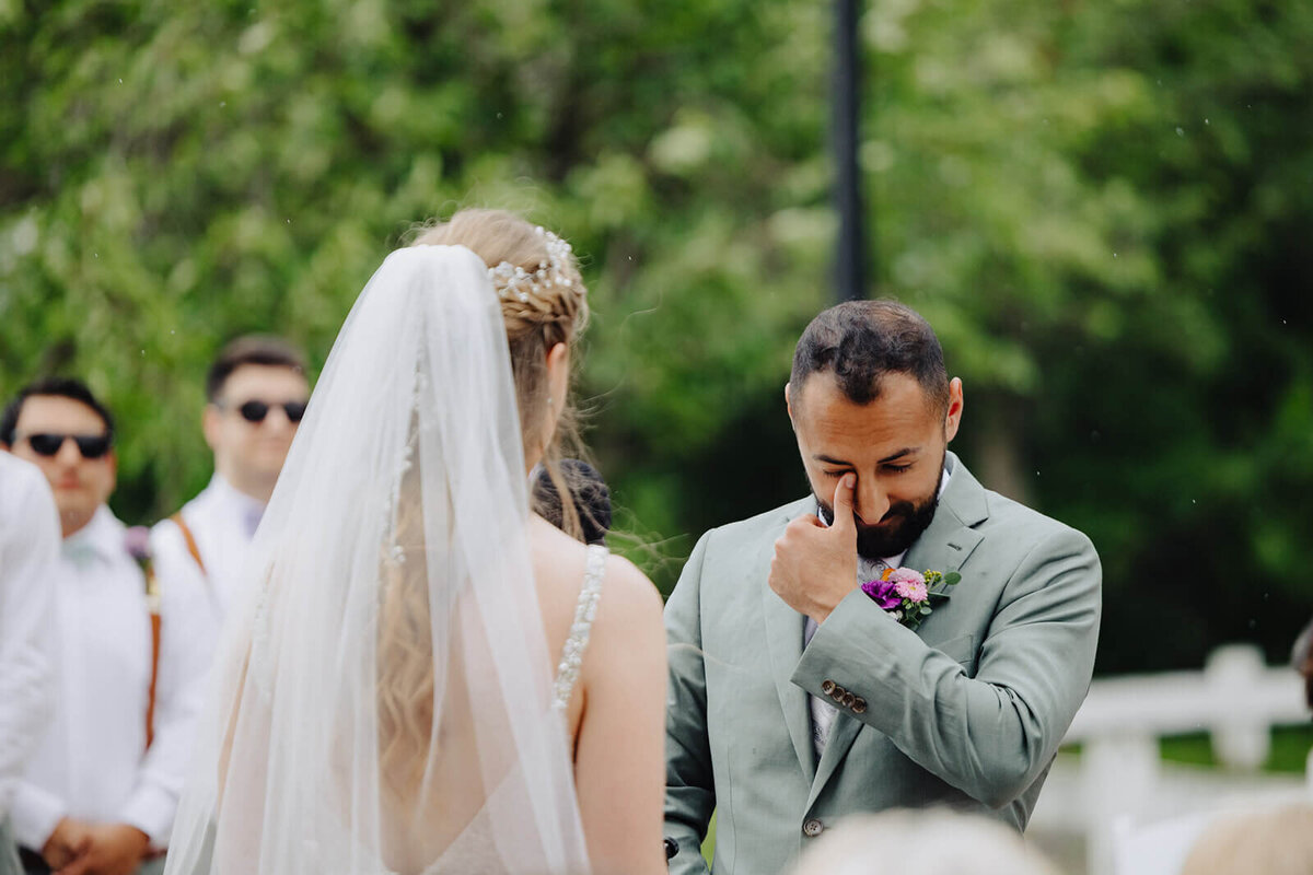Groom looking emotional at Mansion at Keuka Lake wedding, NY