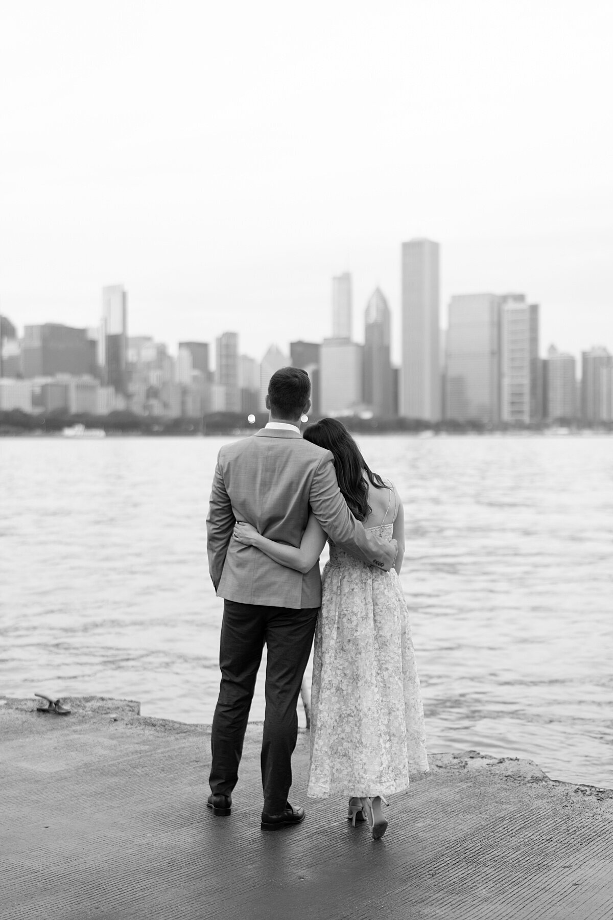 chicago wedding photos of couple looking at Chicago cityscape across the bay by Allison Francois Photography
