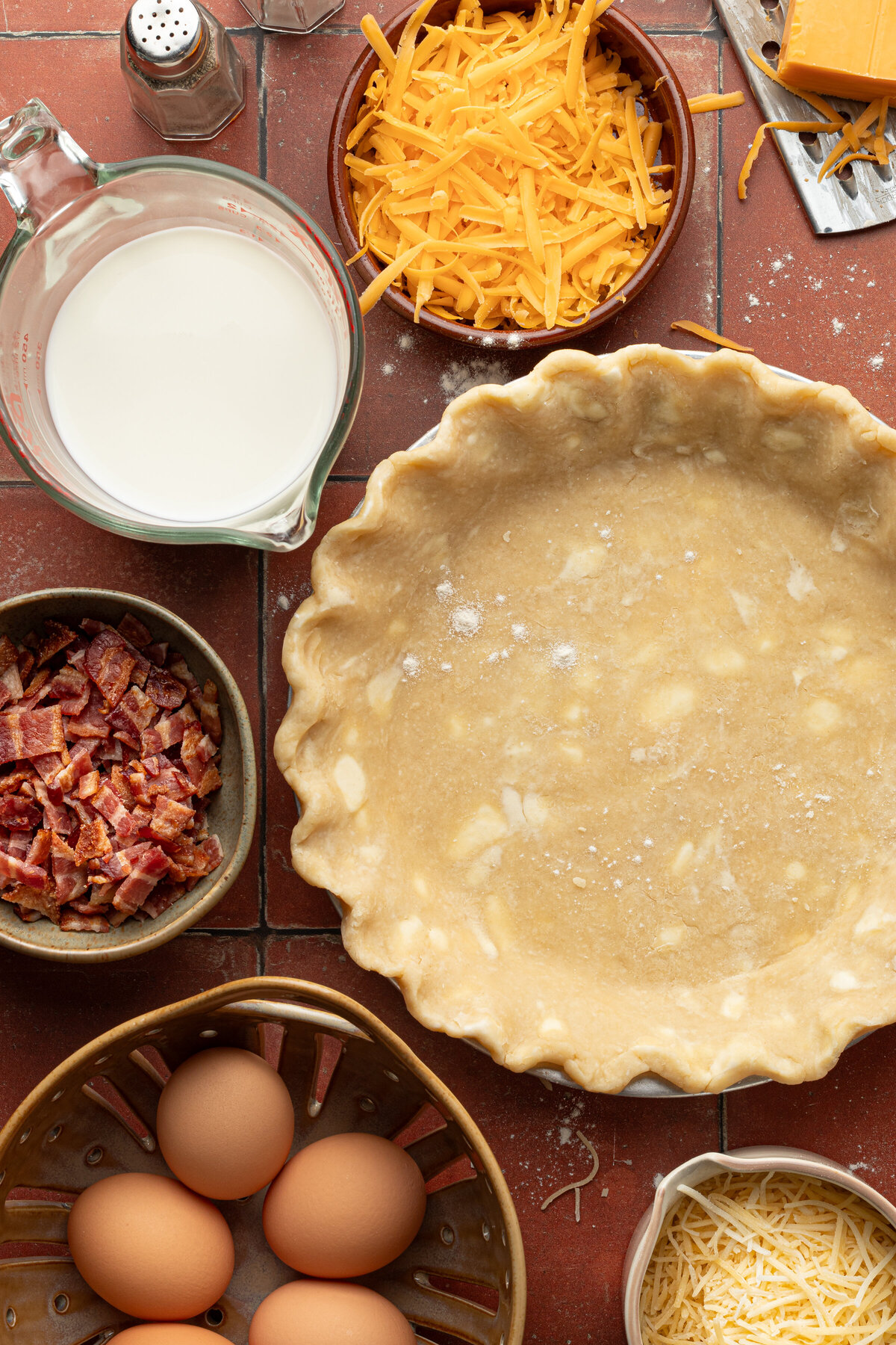 a flat lay of ingredients for a quiche