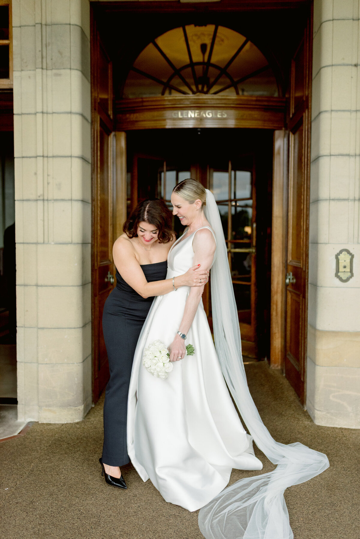 Editorial wedding photography of Bride and Bridesmaid at Gleneagles hotel, Scotland.  Image by luxury wedding photographer, Jill Cherry Porter.