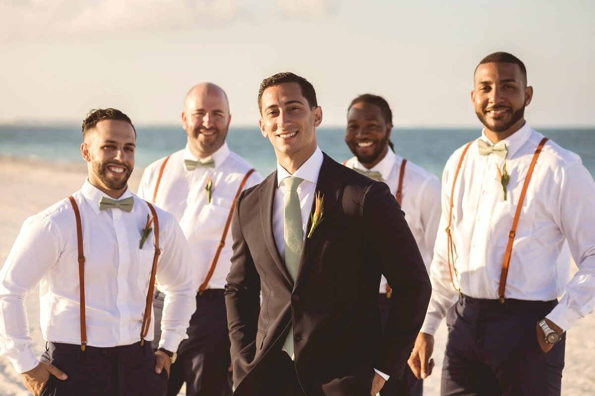 Editorial portrait of groomsmen at wedding in Cancun