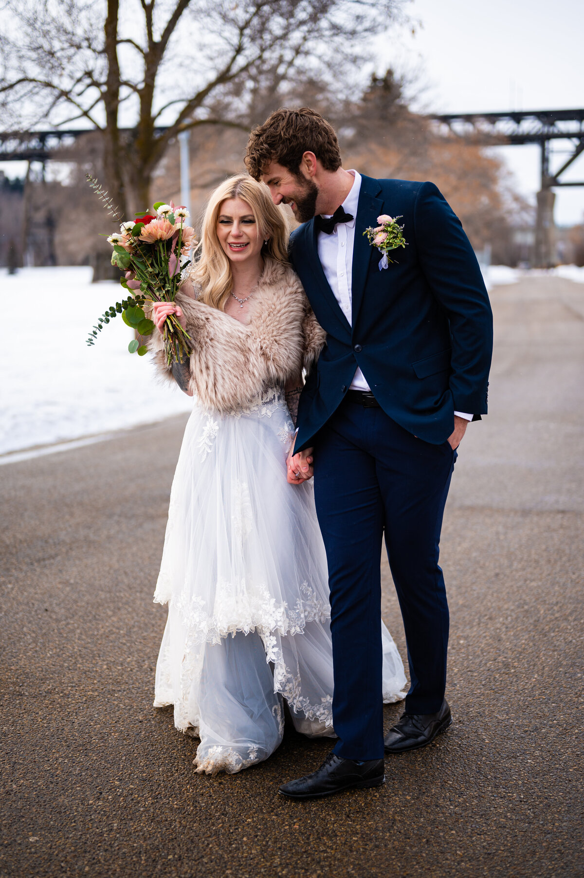 bride and groom celebrate their wedding walk out