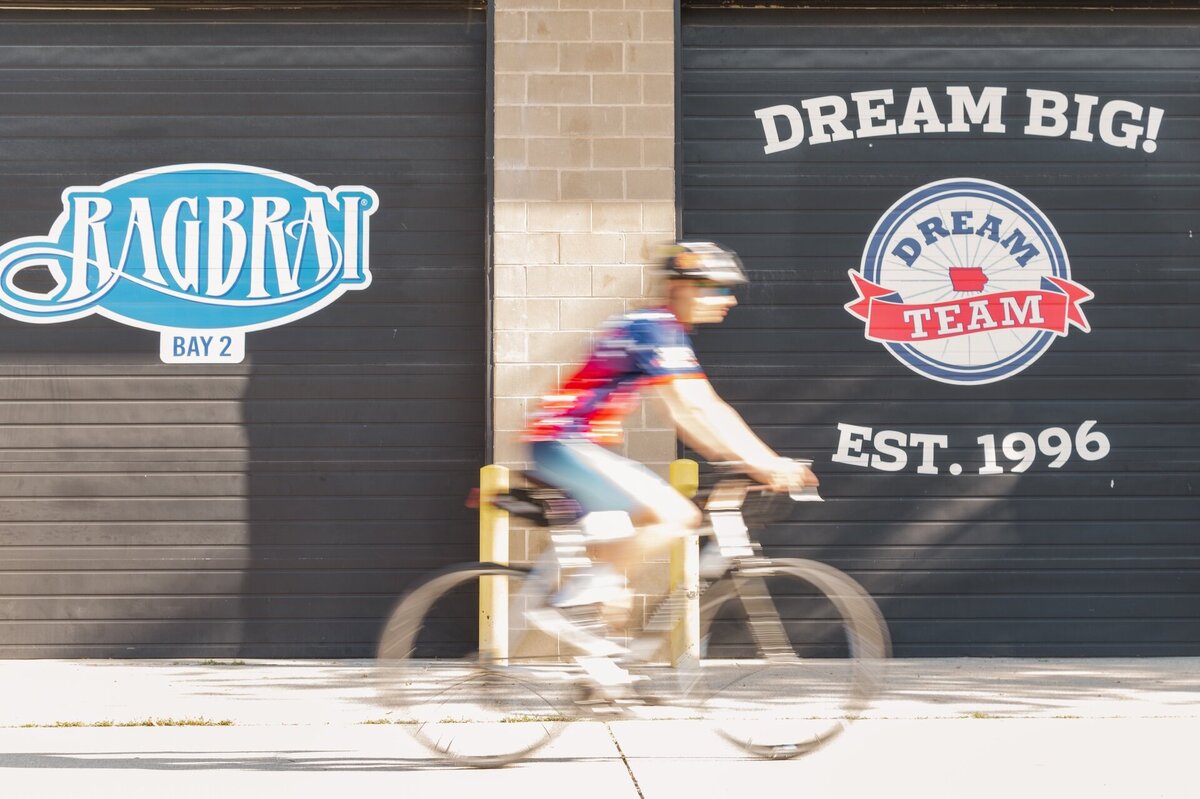 a photo showing a motion blur of someone riding a bike