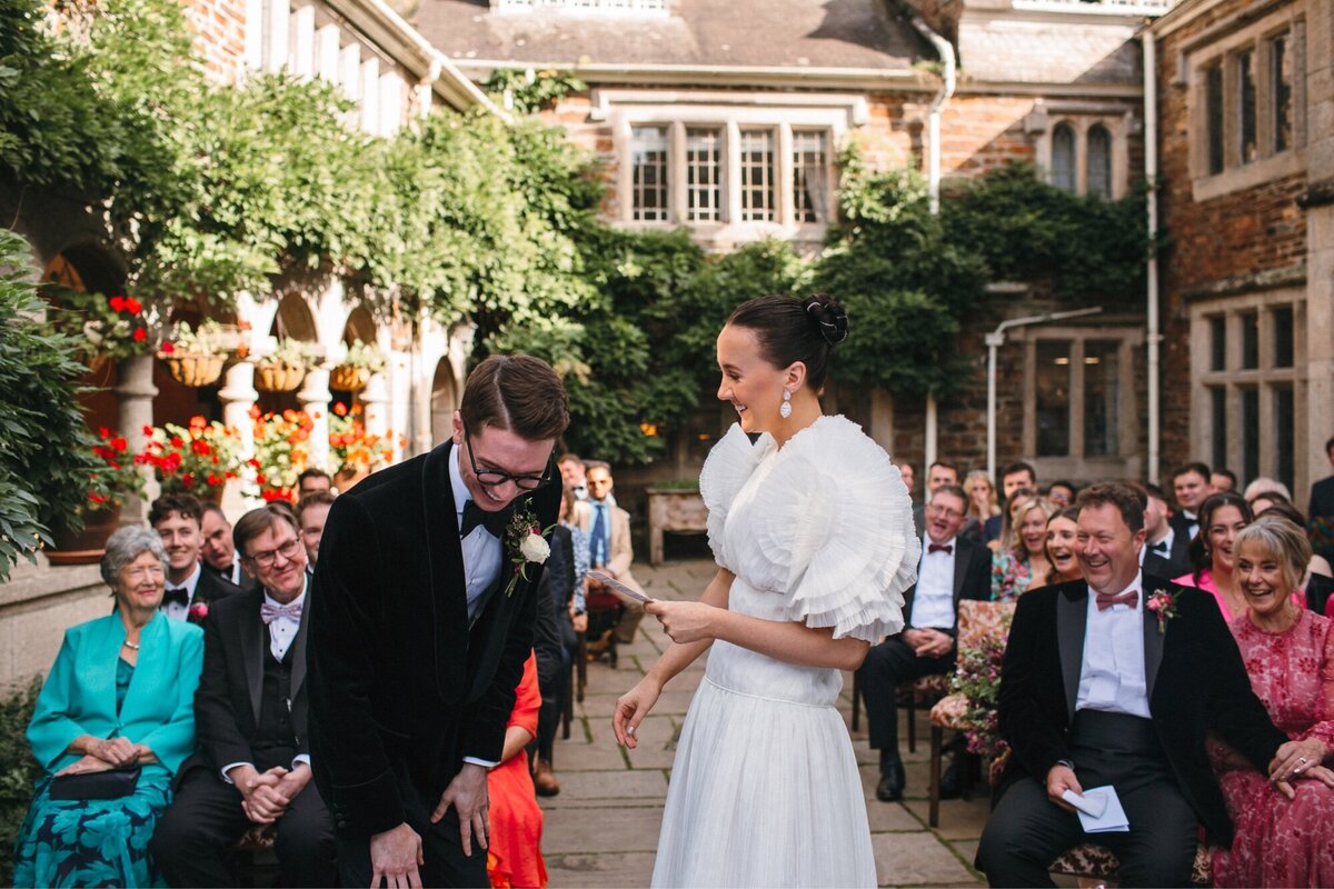 Couple laughing during wedding vows 