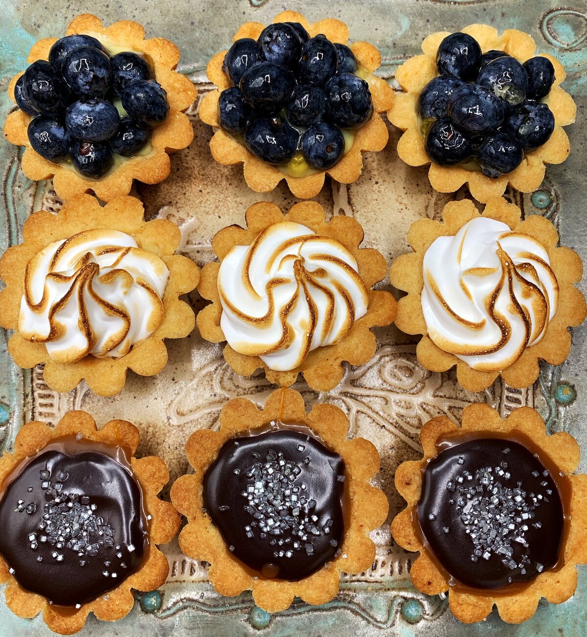 Mini lemon meringue, chocolate caramel, blueberry tartlets