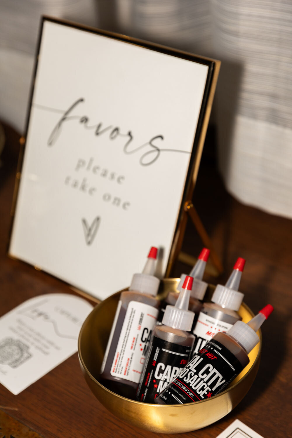 Wedding favor display with sign and gift bottles