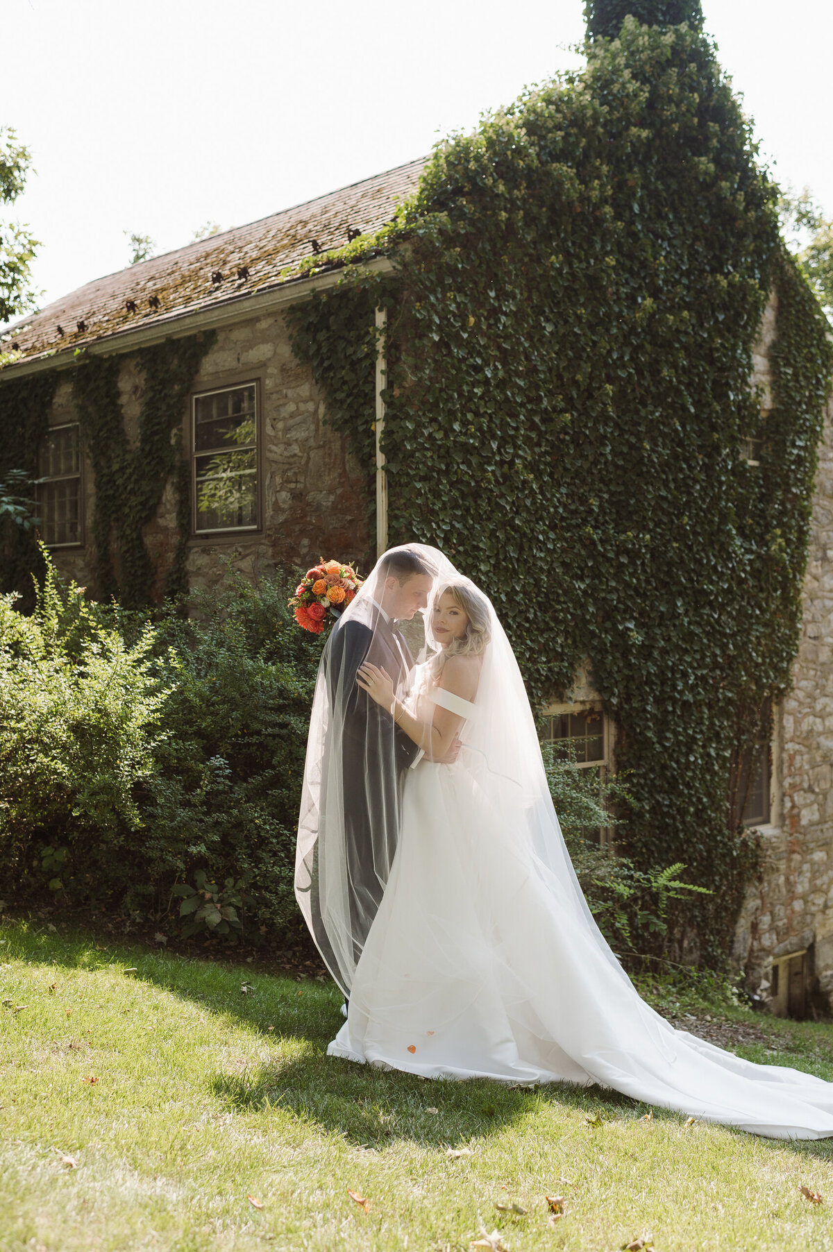 dreamy bride and groom portrait with veil at the inn at millrace pond