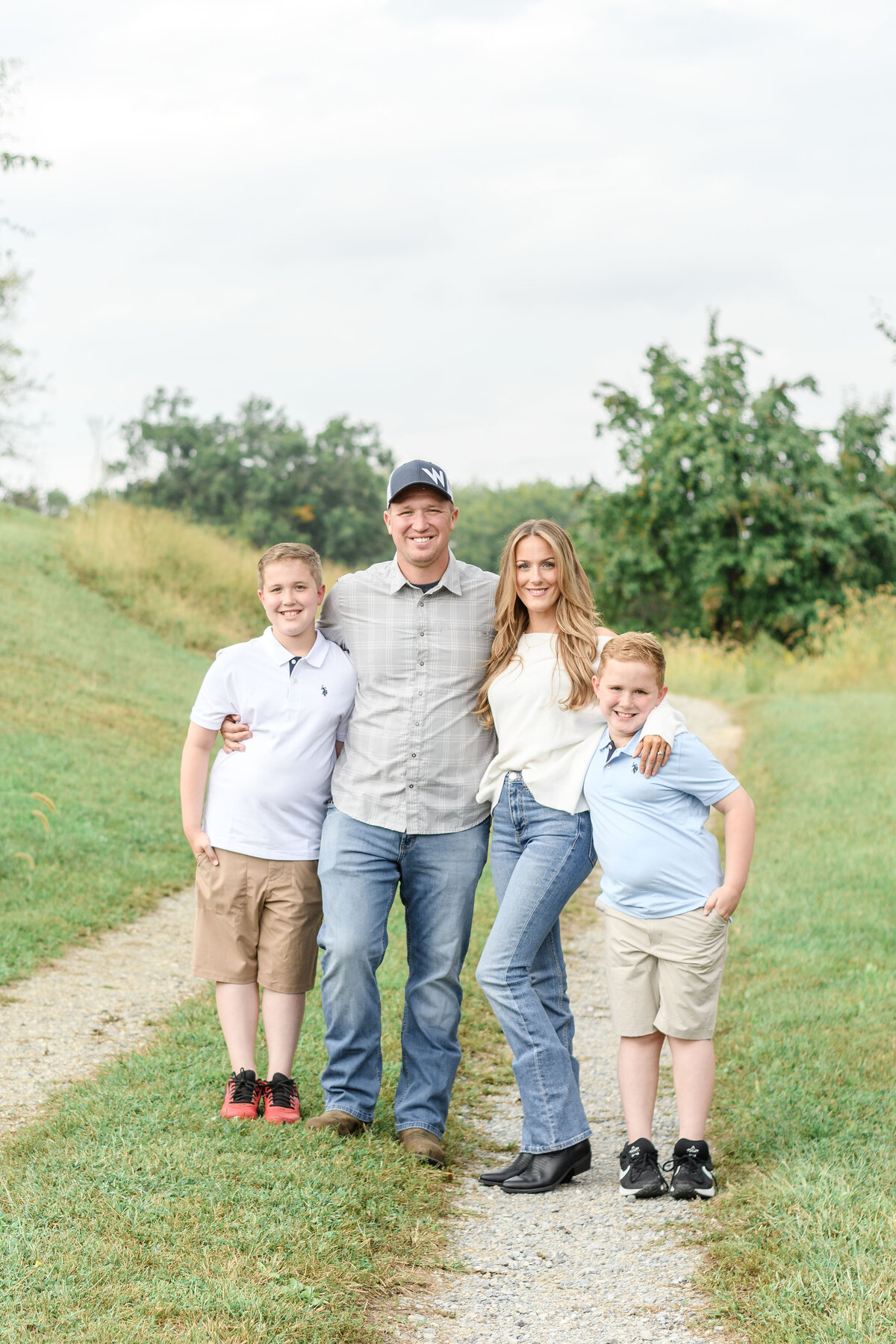 Family of four smiling at the camera