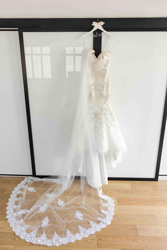 wedding-dress-and-veil-hanging-in-suite
