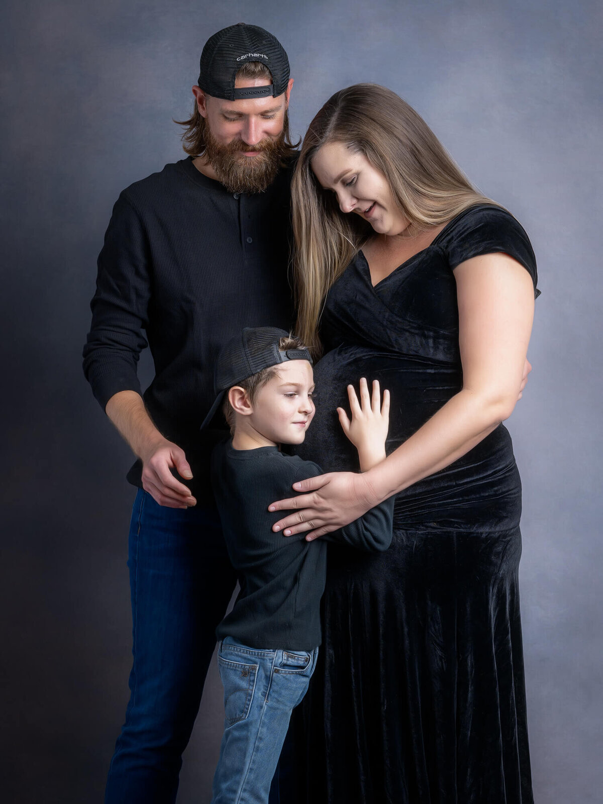 Family poses in studio for Prescott family photos with Melissa Byrne
