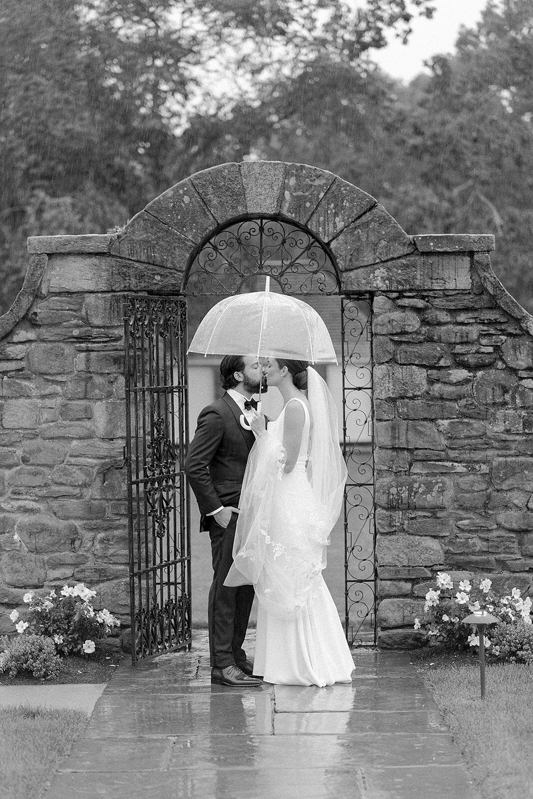 Kate-Murtaugh-Events-RI-wedding-planner-elopement-micro-wedding-intimate-celebration-Shepherds-Run-rain-embrace-umbrella-bride-groom