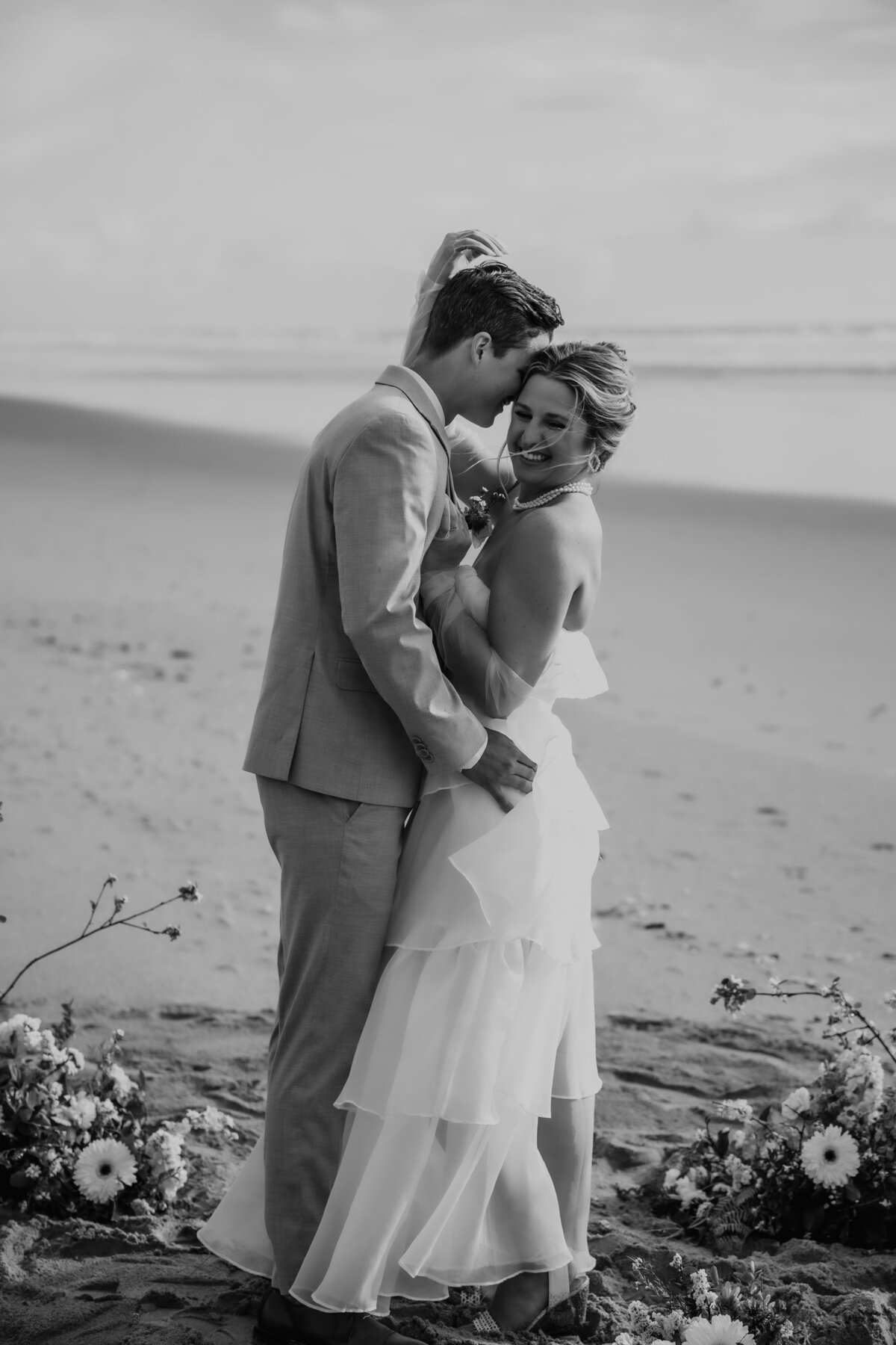 BRIDE AND GROOM PORTRAITS ON BEACH