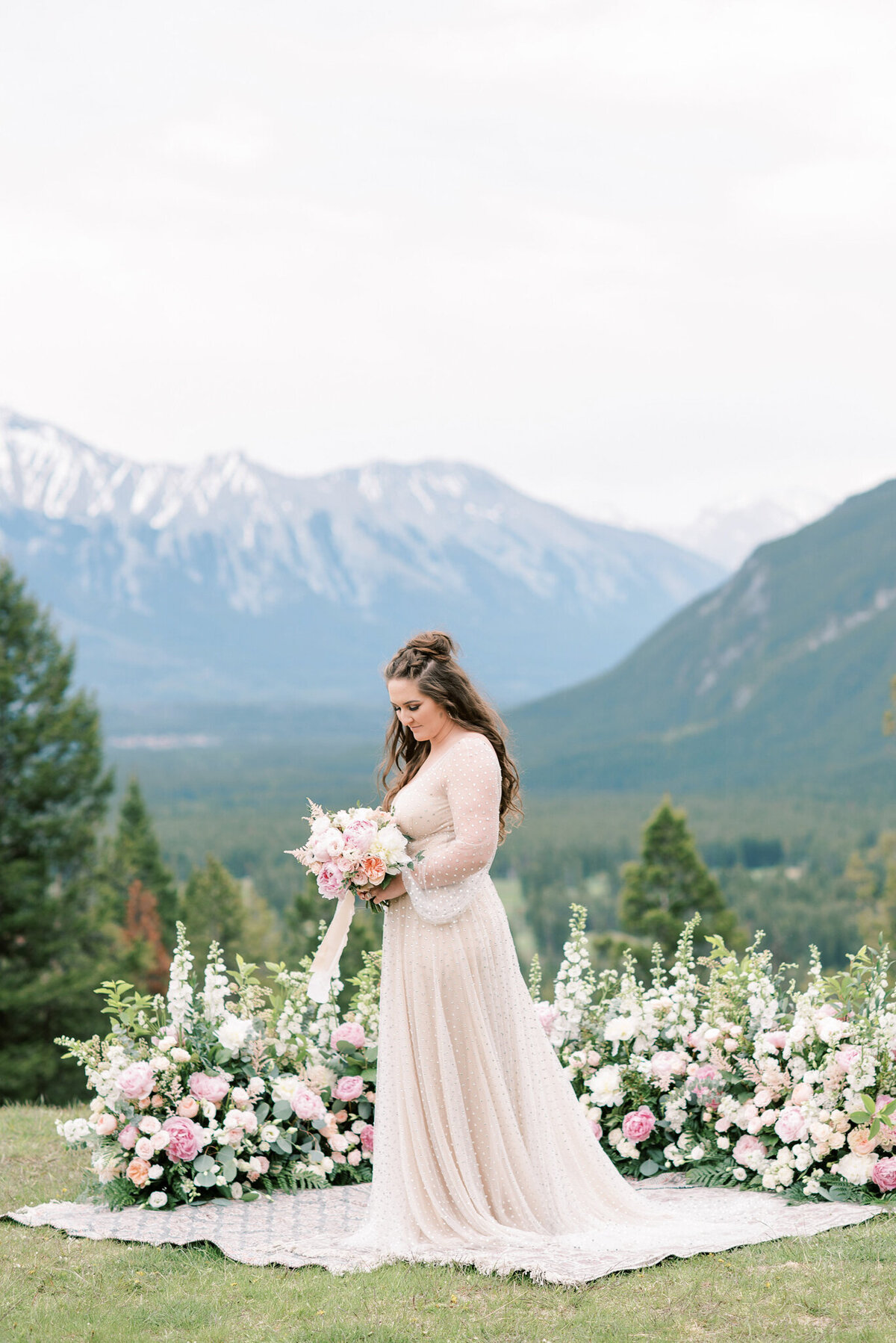 Bridal portrait inspiration with lush pink and white florals by Flowers By Janie, artful Calgary, Alberta wedding florist, featured on the Brontë Bride Vendor Guide.
