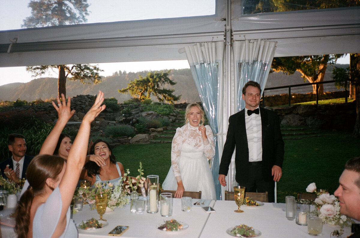 Couple entering reception with people cheering at The Griffin House in Hood River.