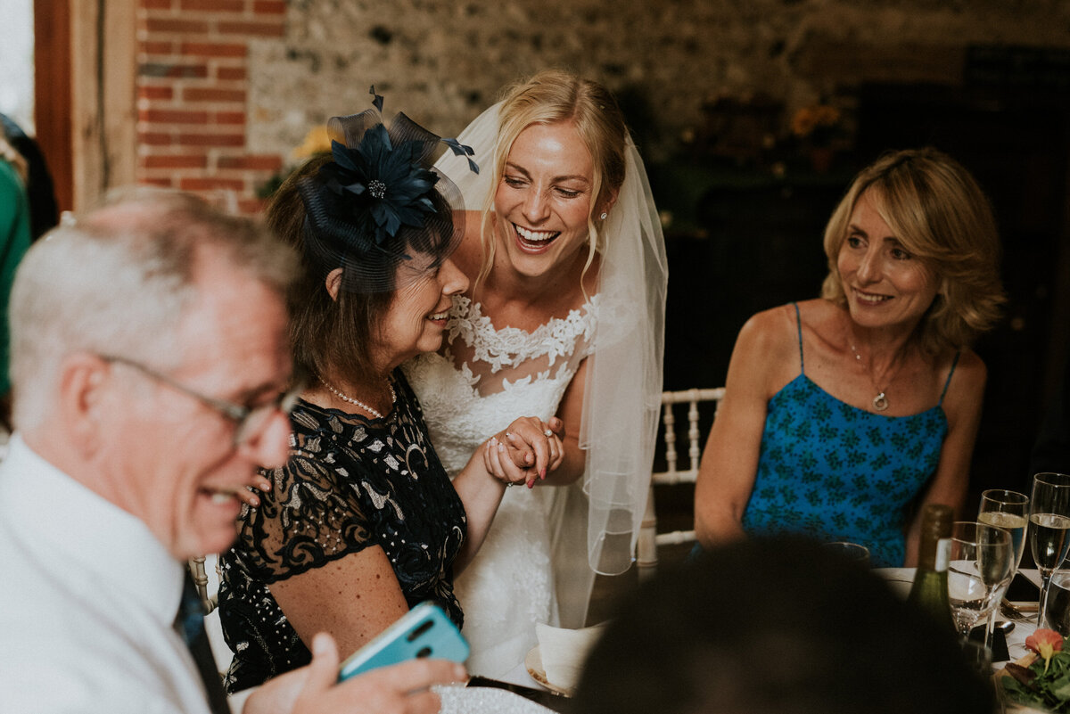 Bride laughing with her mum