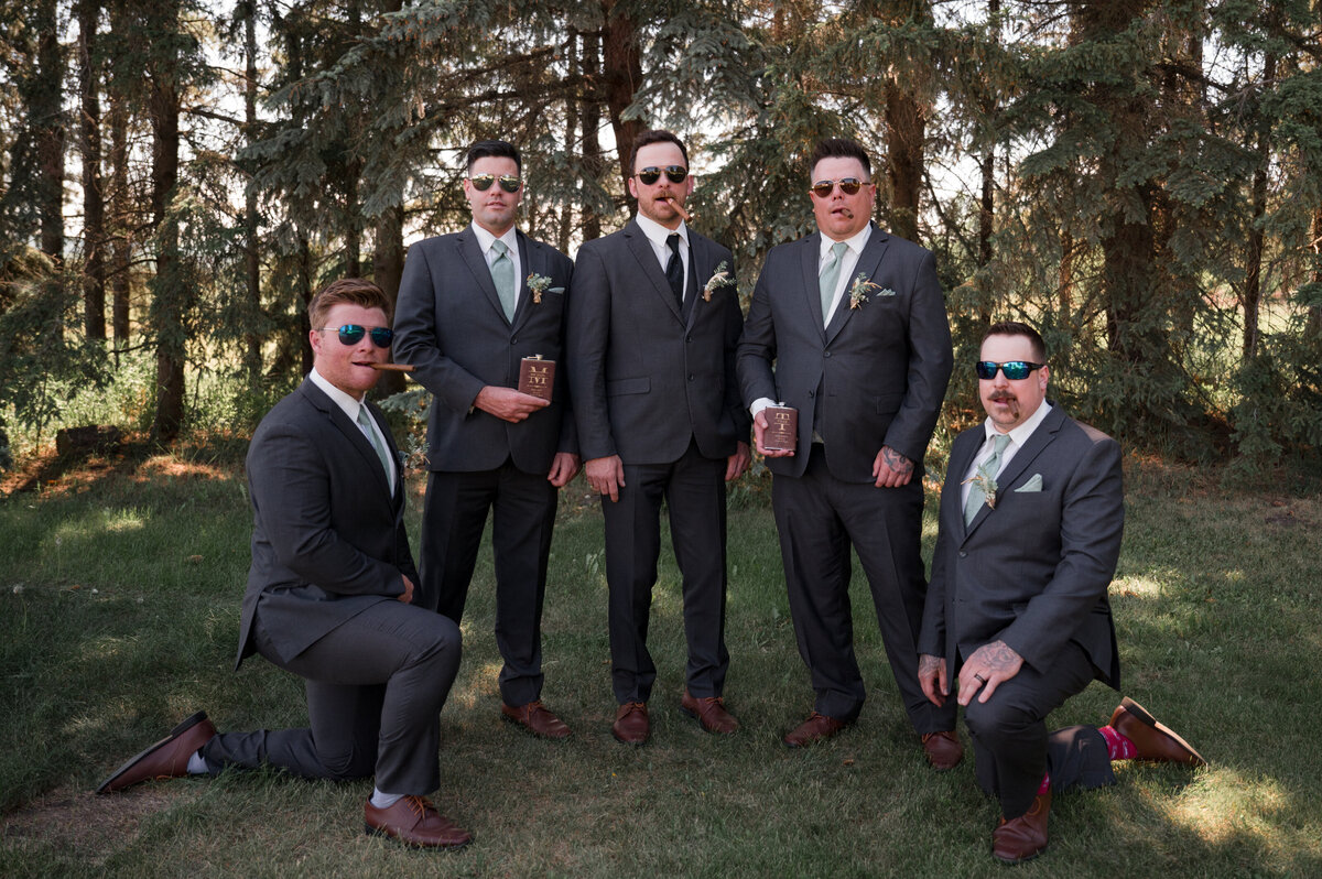 groom and groomsmen in fun wedding day portrait