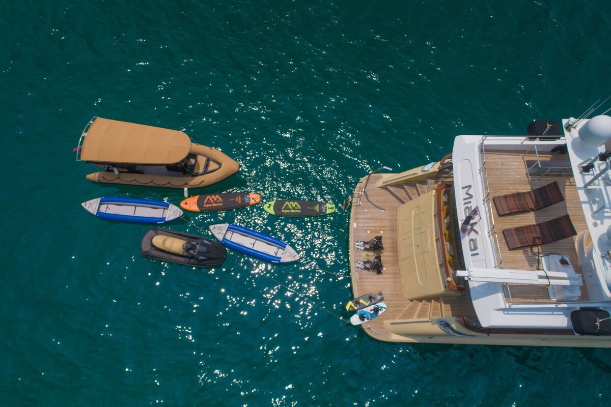 Adventure yacht charter featuring jet skis, paddleboards, and water toys in Ang Thong Marine National Park, Thailand.
